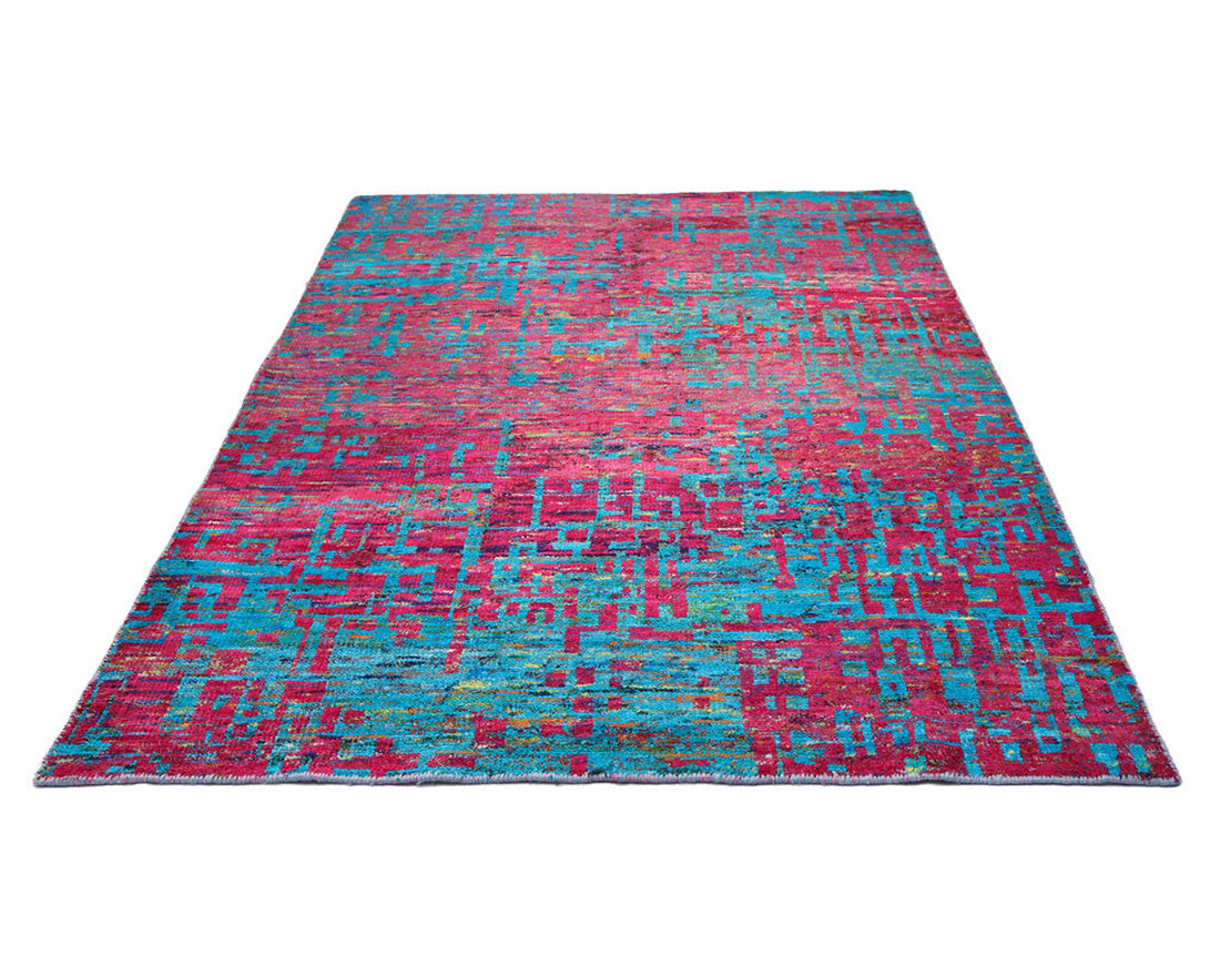 blue and pink rug woven from recycled sari silks 