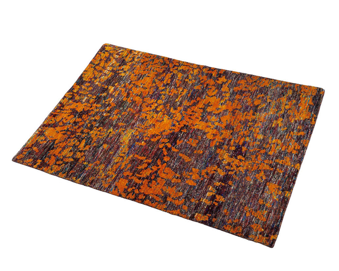 orange and purple rug woven from recycled sari silks