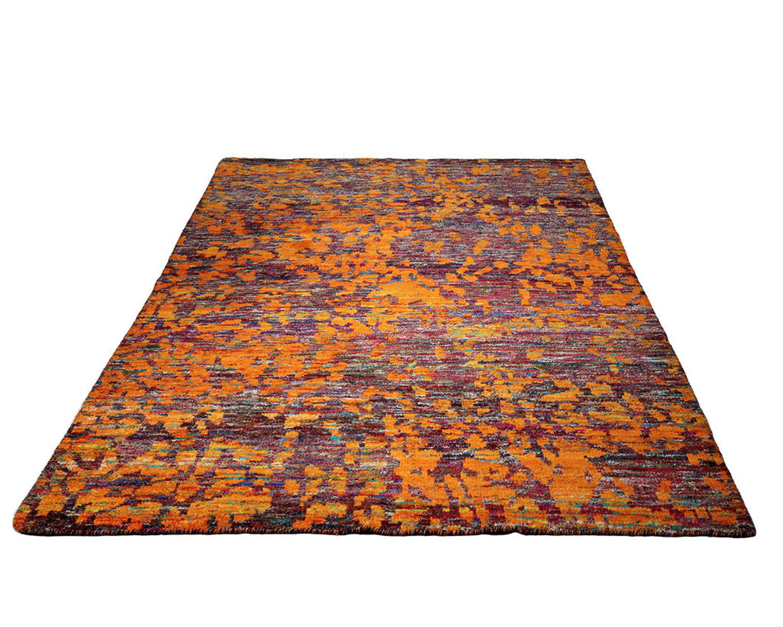 orange and purple rug woven from recycled sari silks