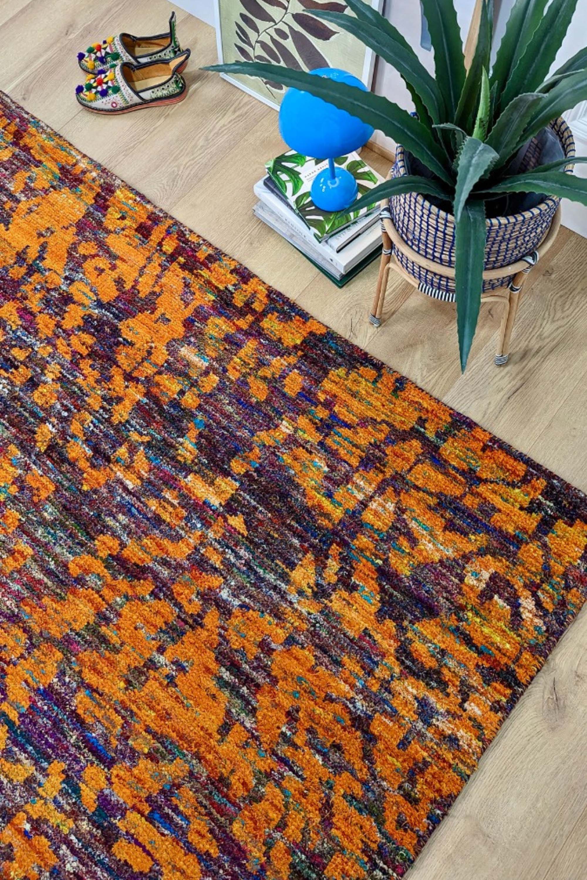orange and purple rug woven from recycled sari silks