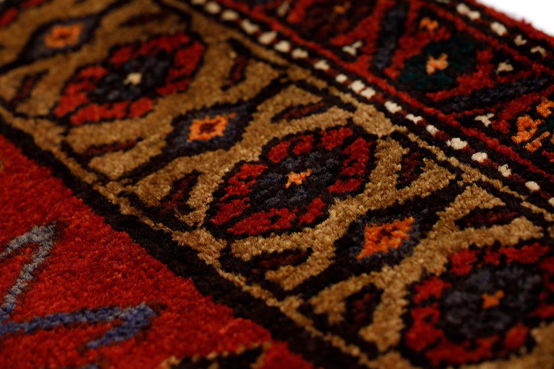 authentic persian runner with stylised geometric design in red