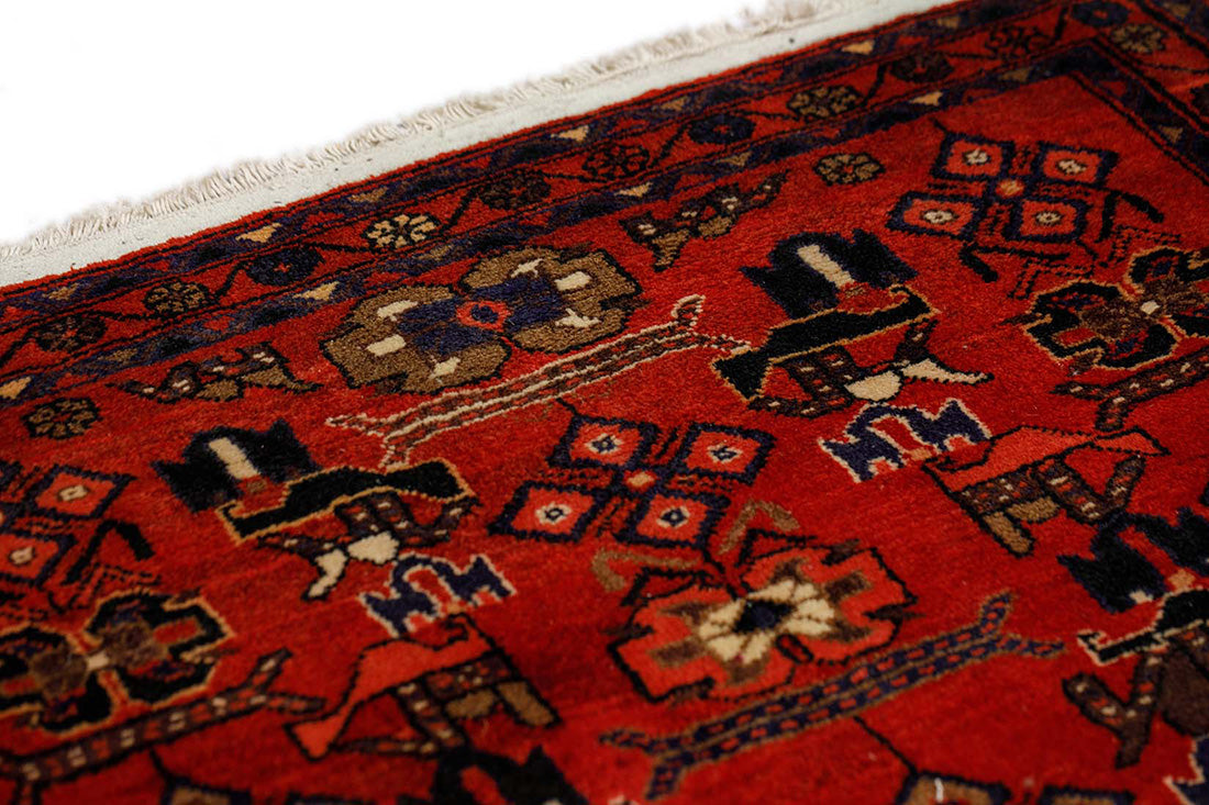 authentic persian runner with traditional floral design in red