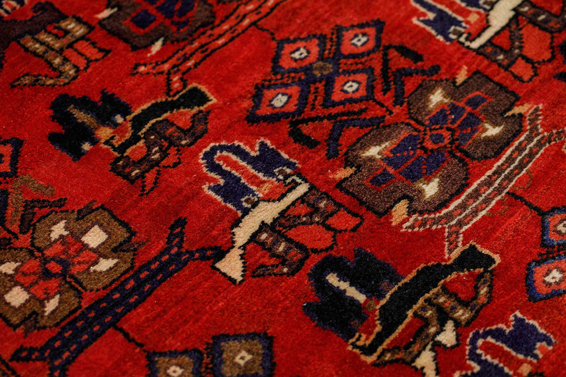 authentic persian runner with traditional floral design in red