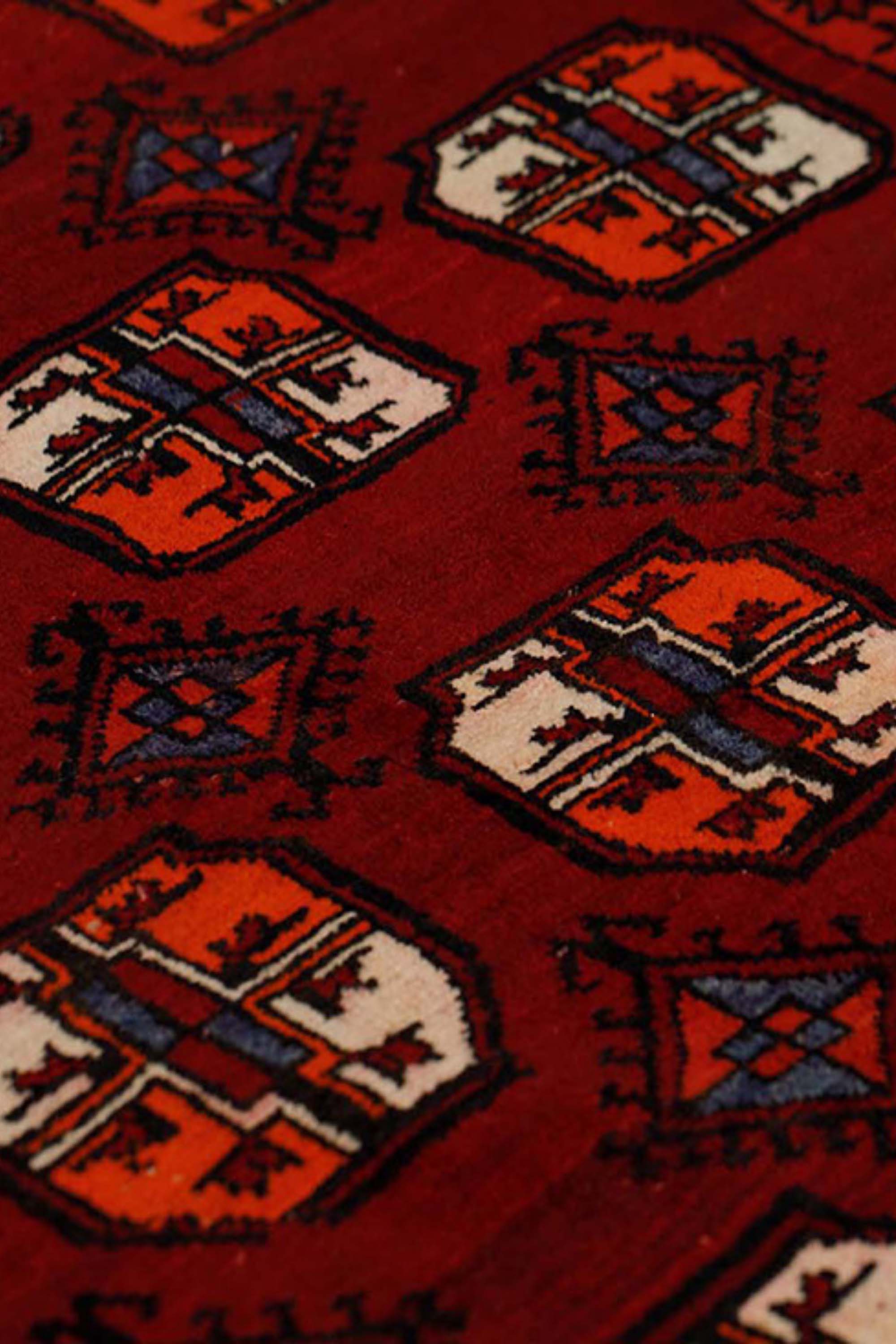 authentic oriental runner with traditional tribal geometric design in red ivory and black