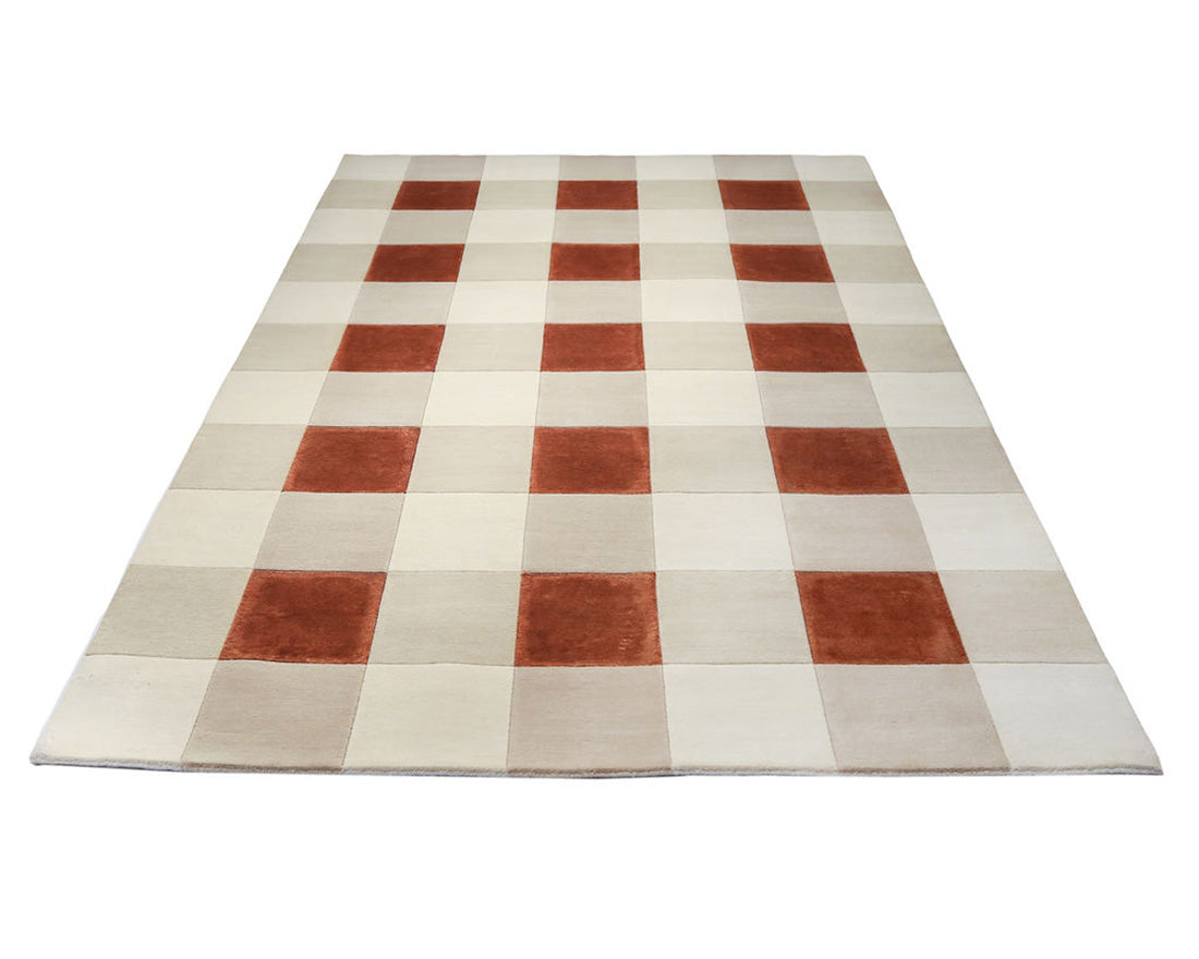 cream and copper rug with geometric pattern