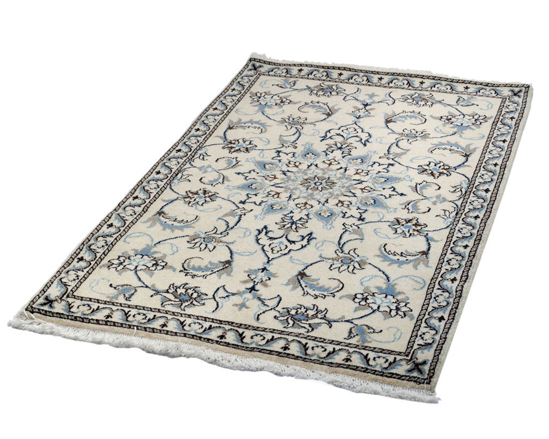 authentic persian rug with a traditional floral design in blue