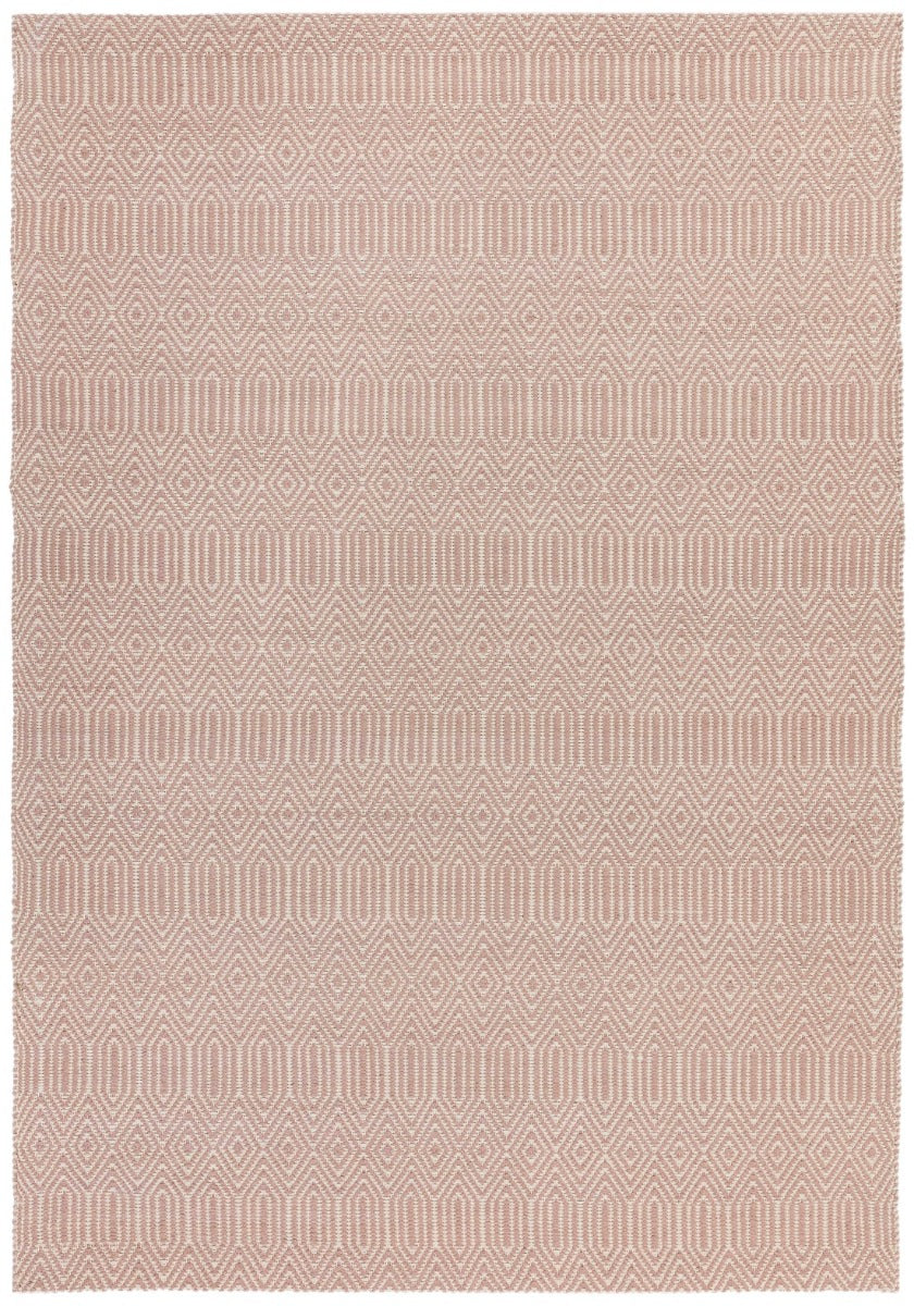 pink and white rug with a geometric aztec pattern