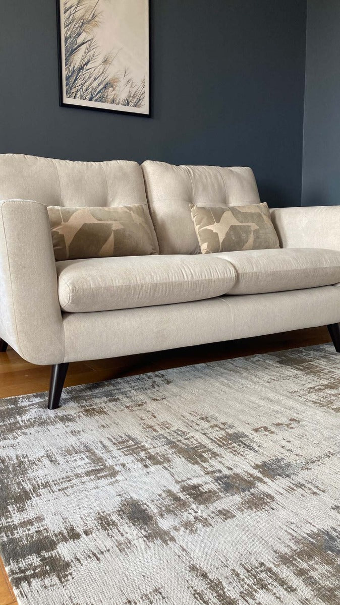 beige flatweave rug with modern abstract design
