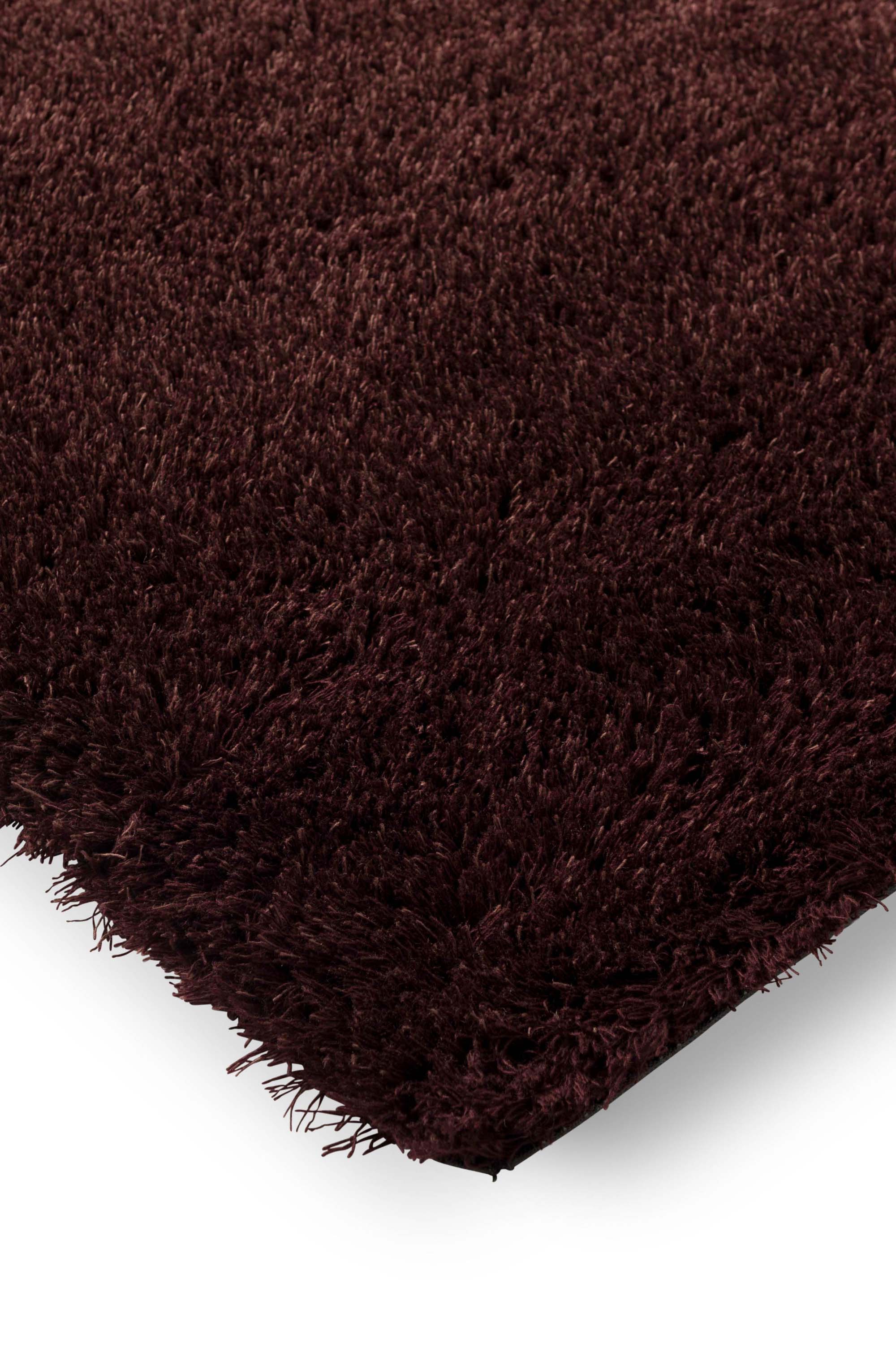 Plain red rug with shaggy pile