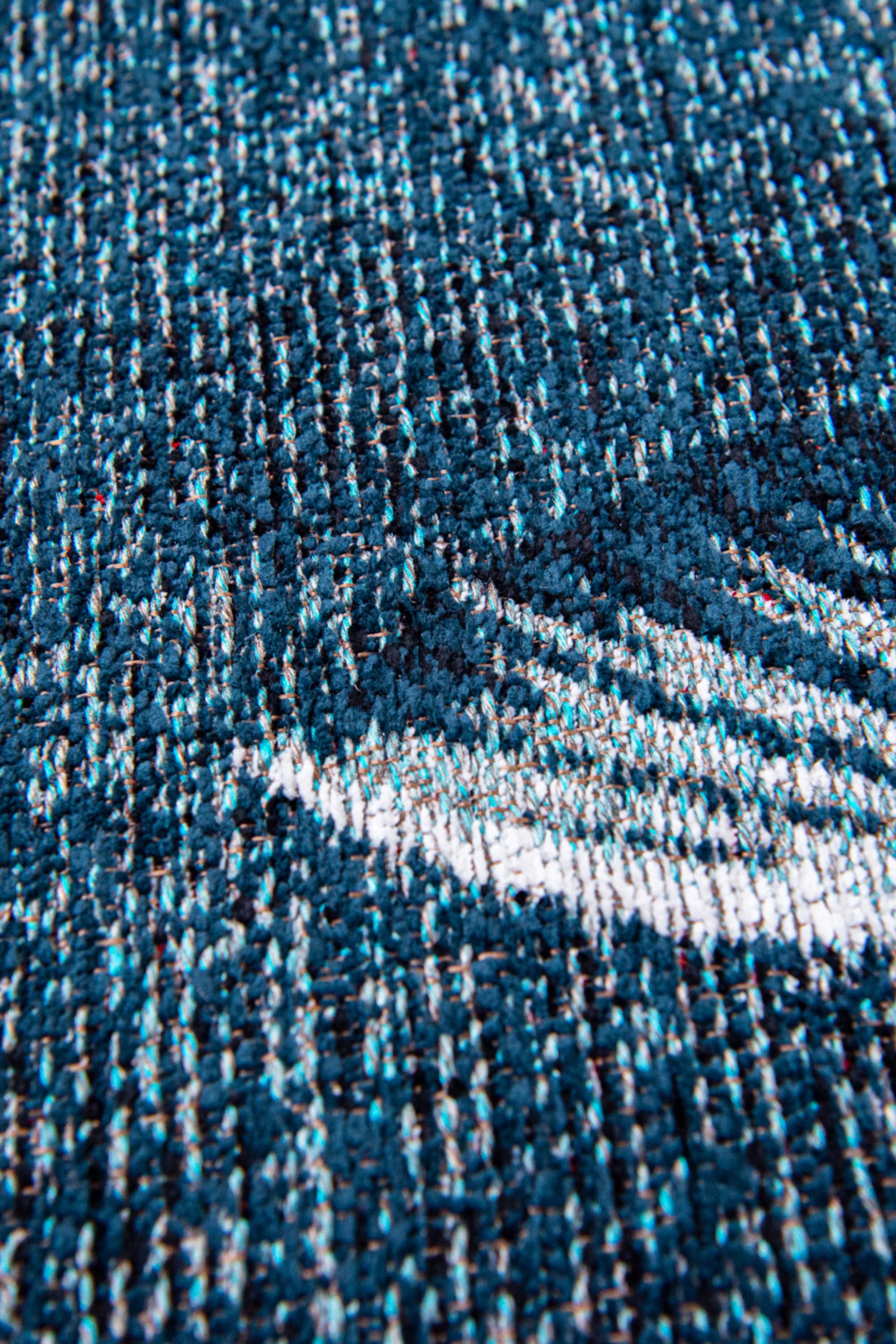Modern navy circle rug with detailed koi fish print