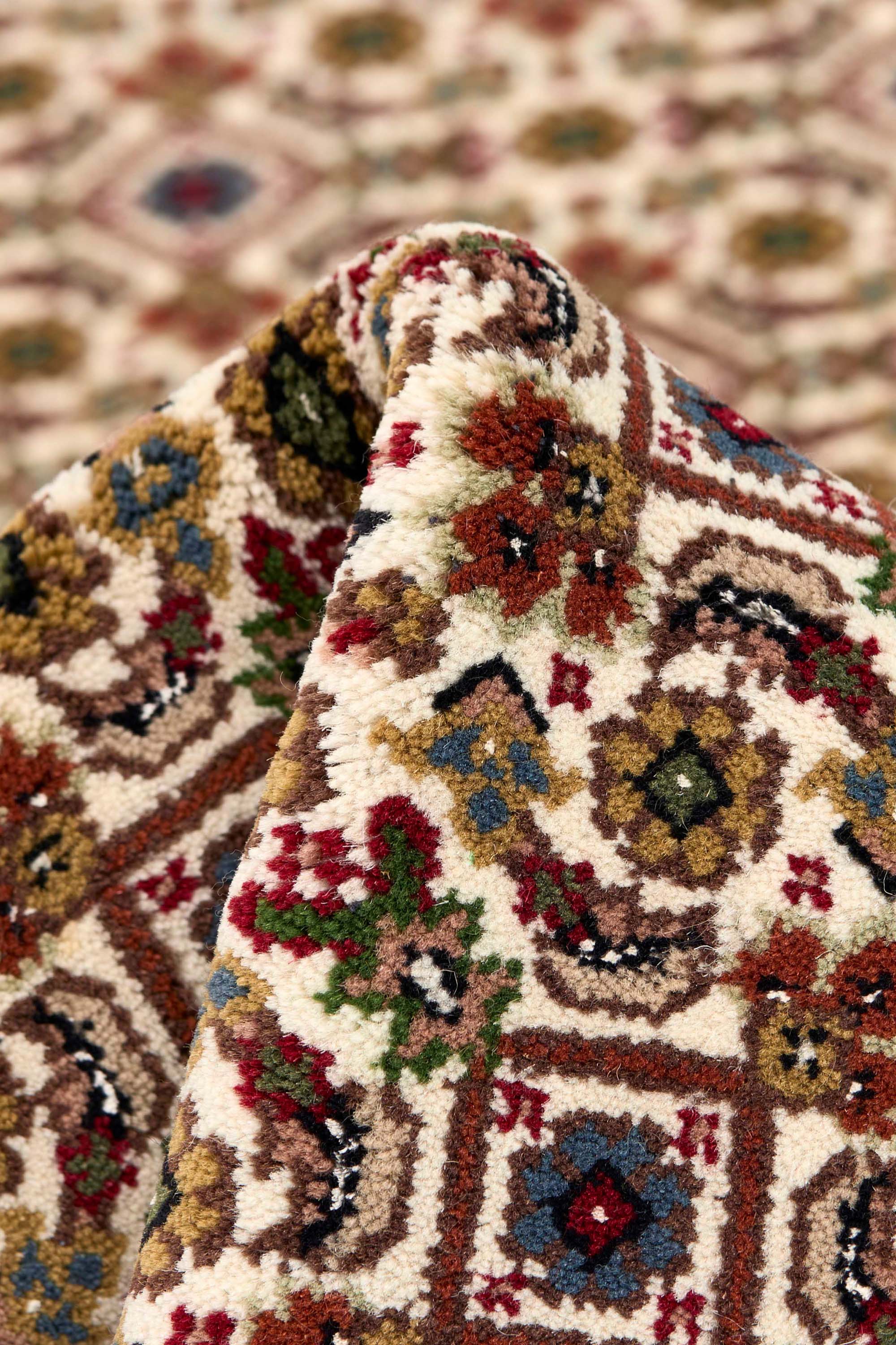Traditional bordered brown Tabriz rug