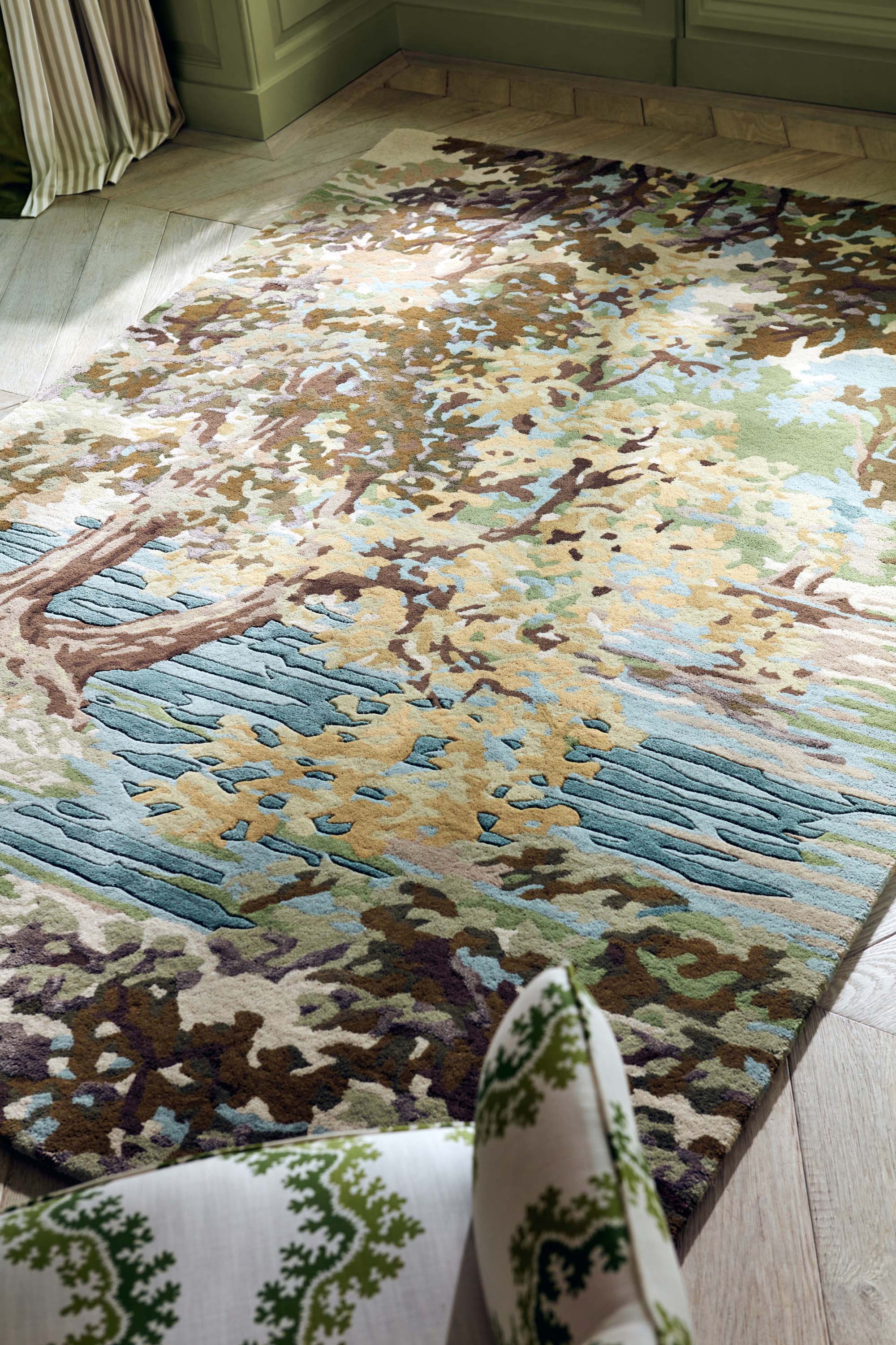 Green, blue and brown floral rug with waterside pattern