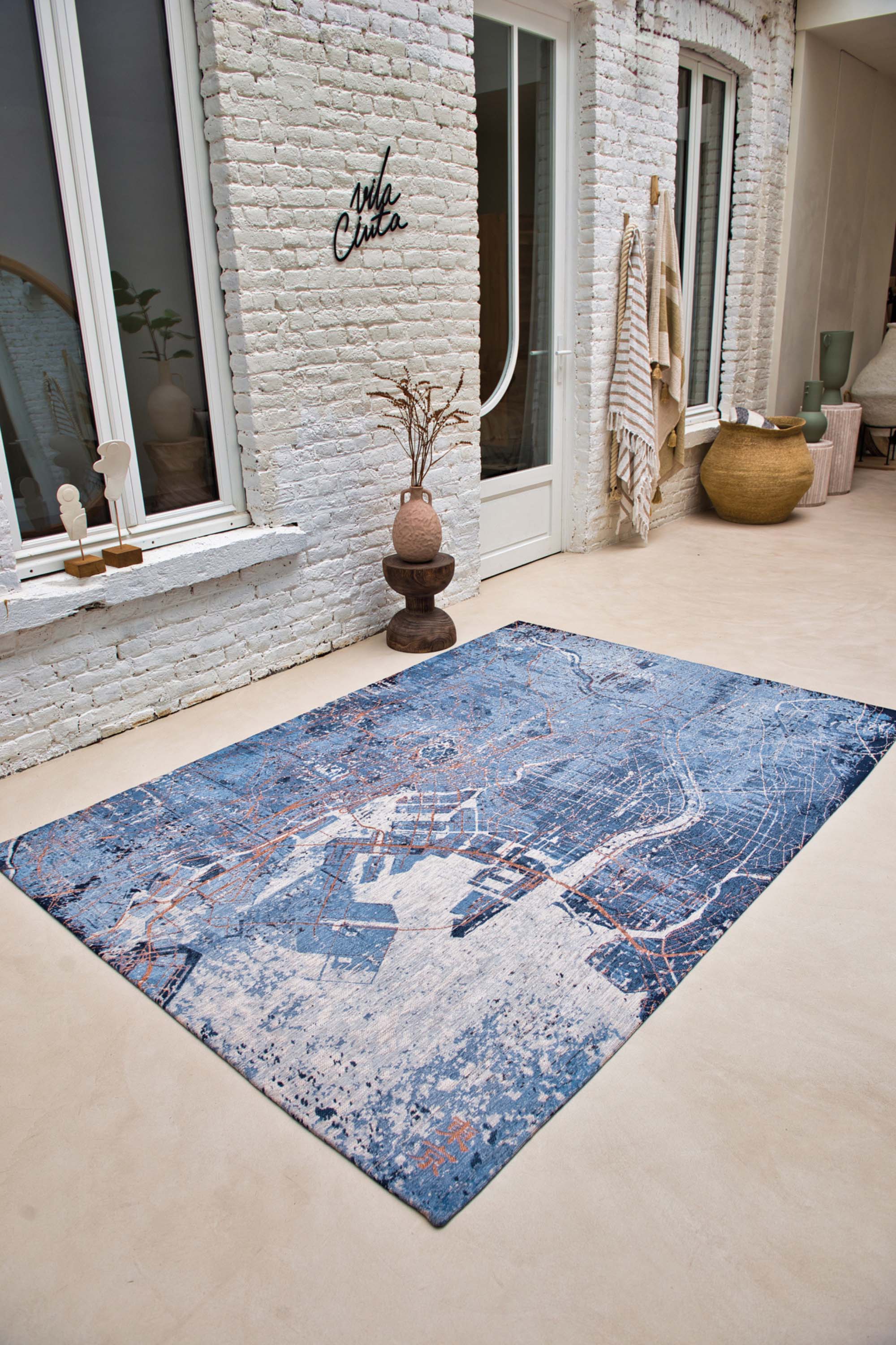 Blue abstract rug with a pattern inspired by the map of Tokyo