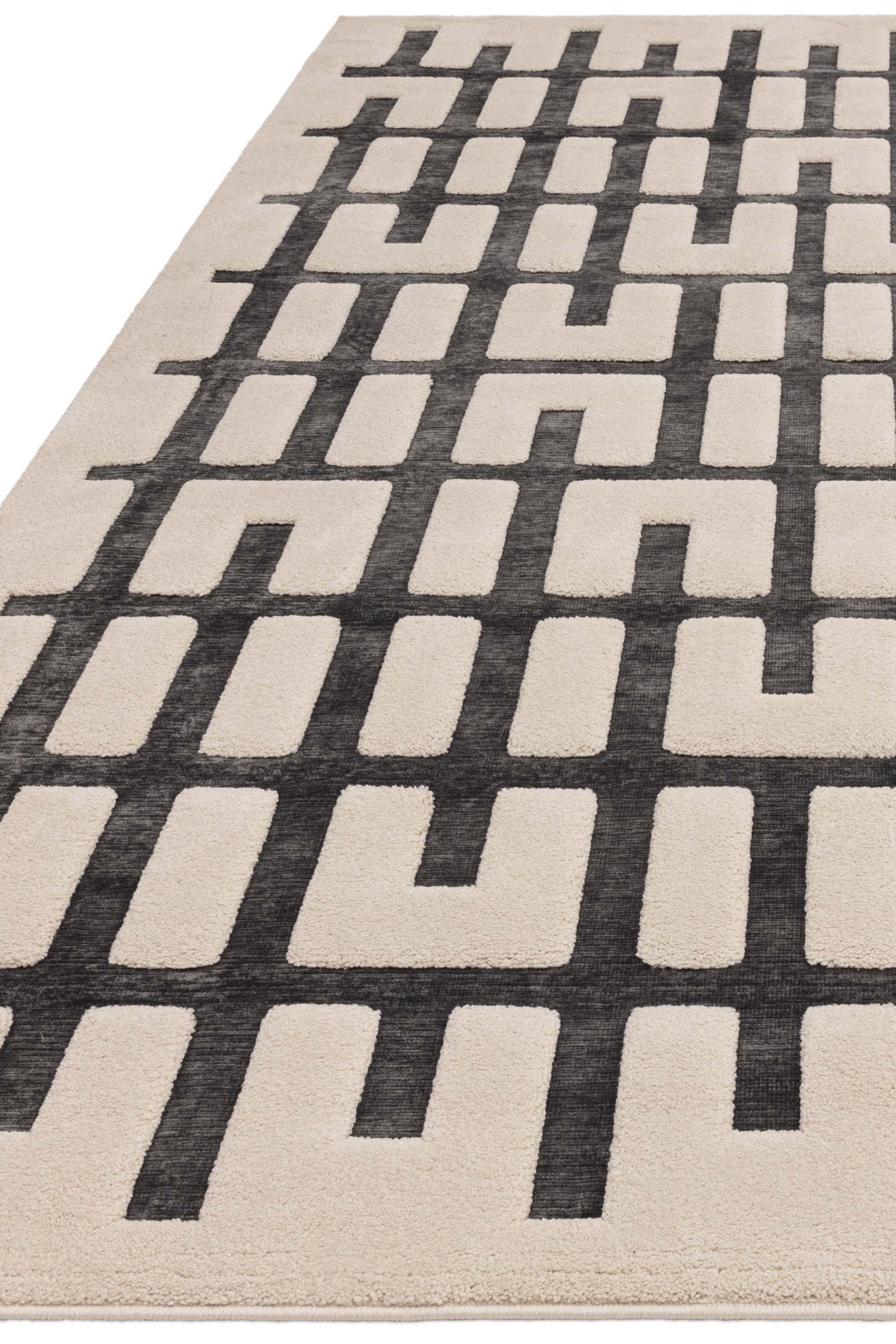 Cream rug with high-low pile and minimal geometric pattern 