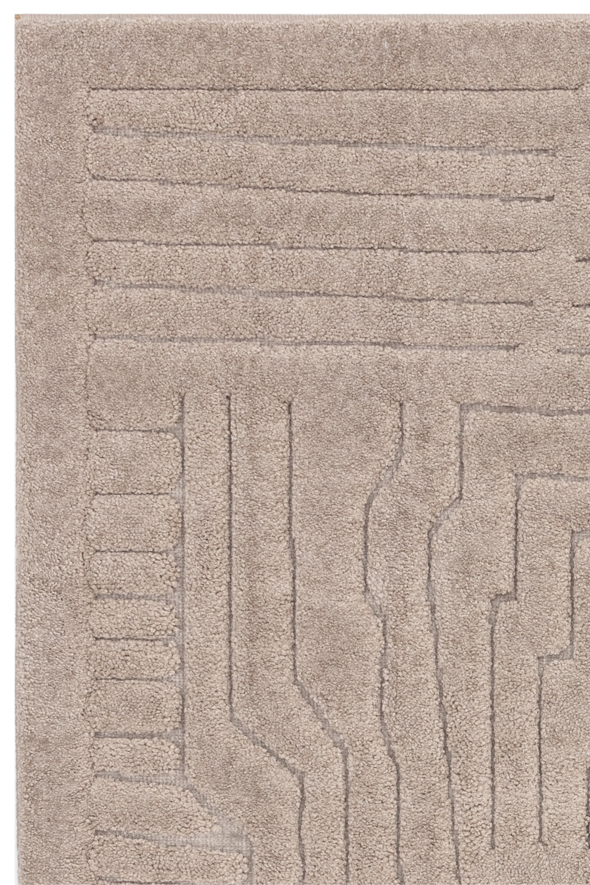 Beige rug with high-low pile and minimal geometric pattern 