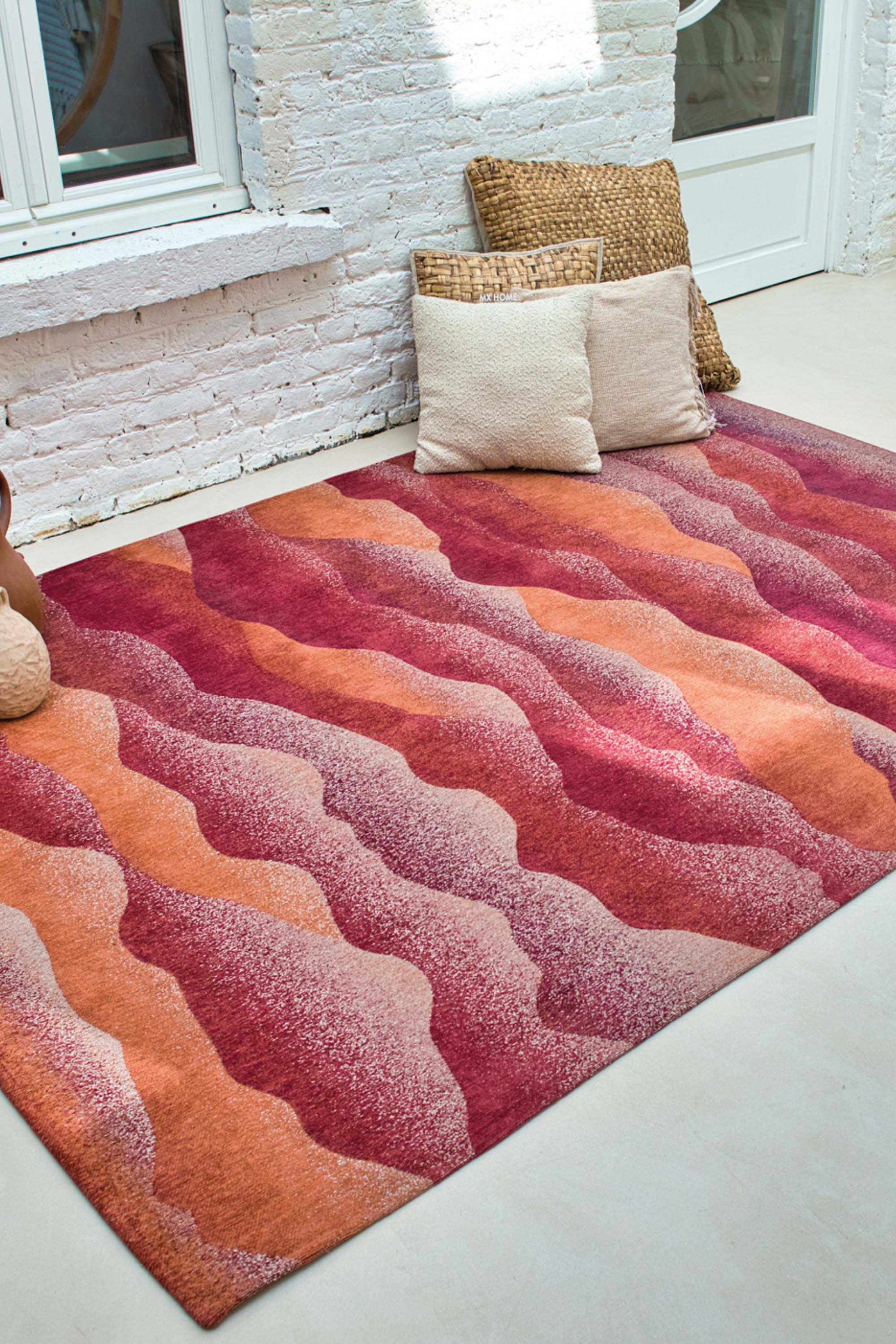 Modern rug with red abstract mountain range pattern