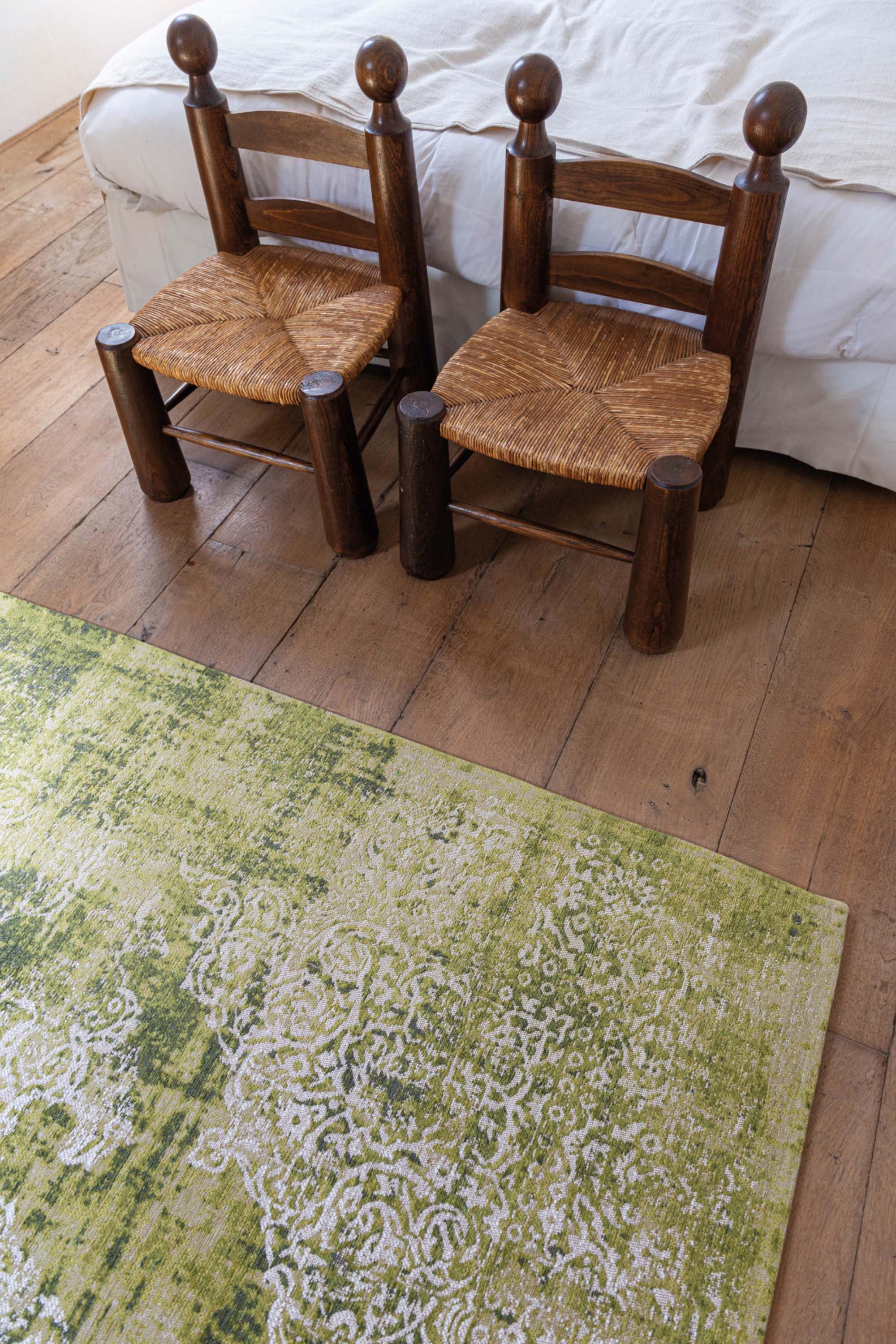 Green vintage Kirman-inspired rug with faded medallion pattern