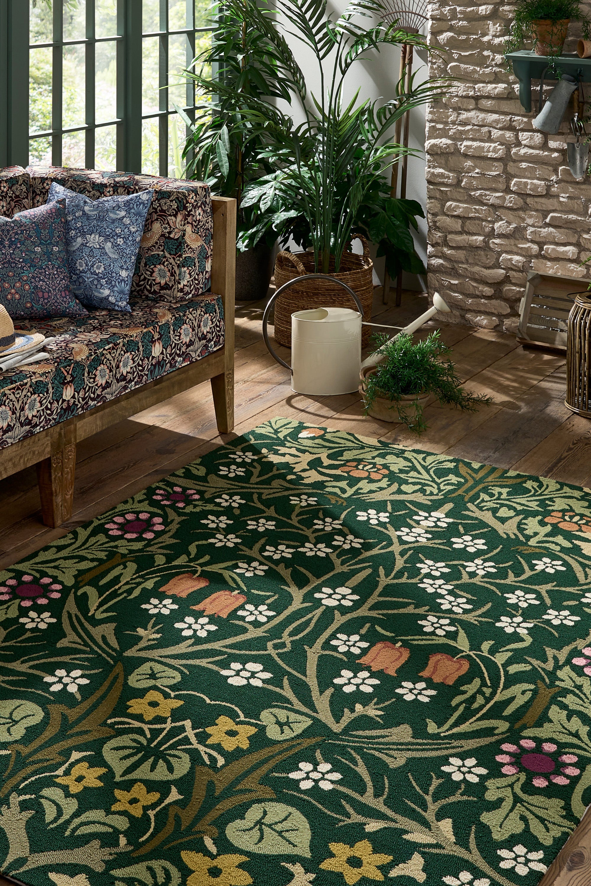 green indoor/outdoor rug with floral pattern