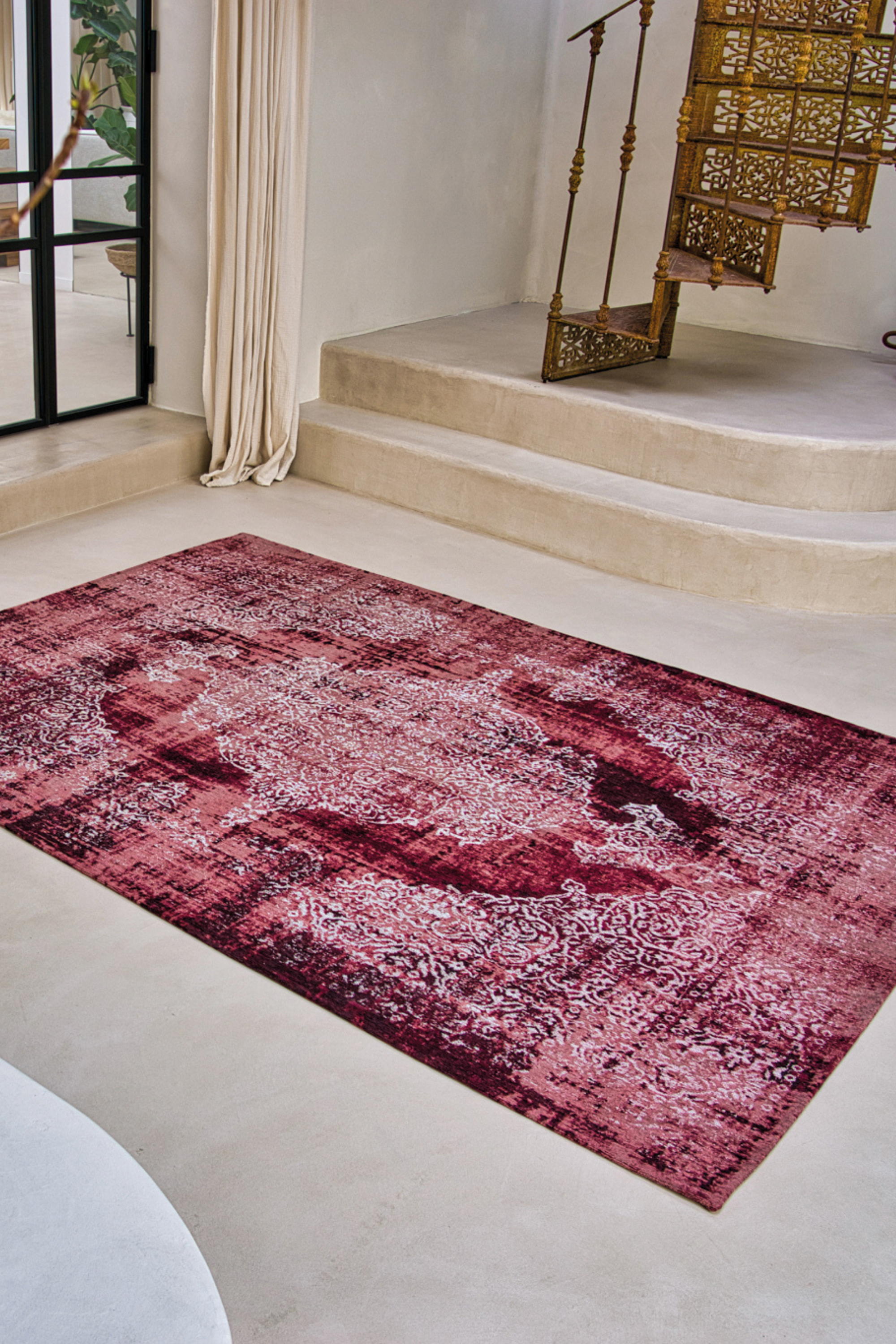 Red vintage Kirman-inspired rug with faded medallion pattern