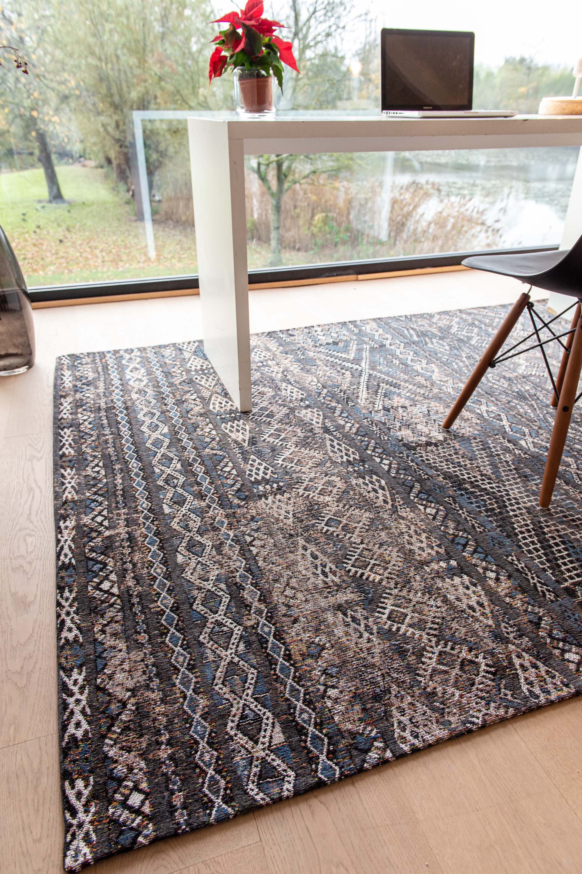 brown rug with a moroccan geometric pattern
