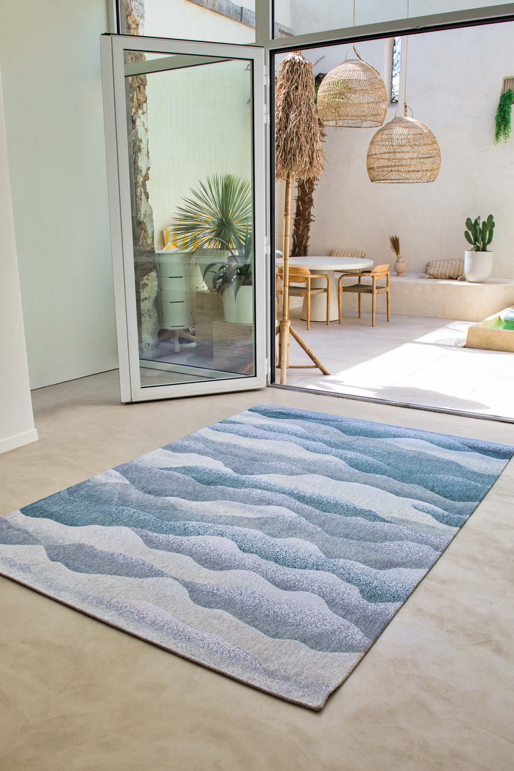 Modern rug with blue abstract mountain range pattern
