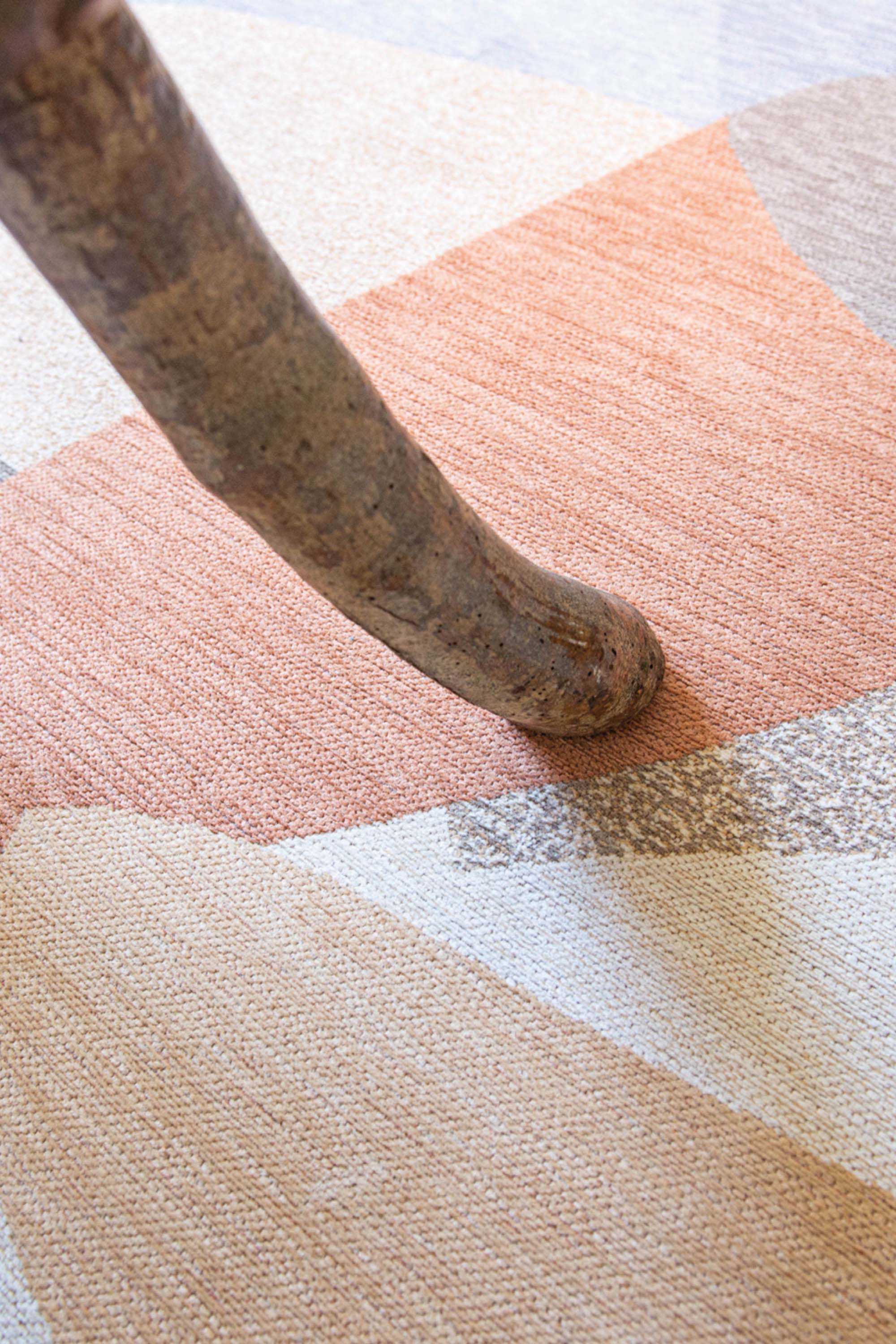 Modern rug with red, blue, white, and grey abstract pattern