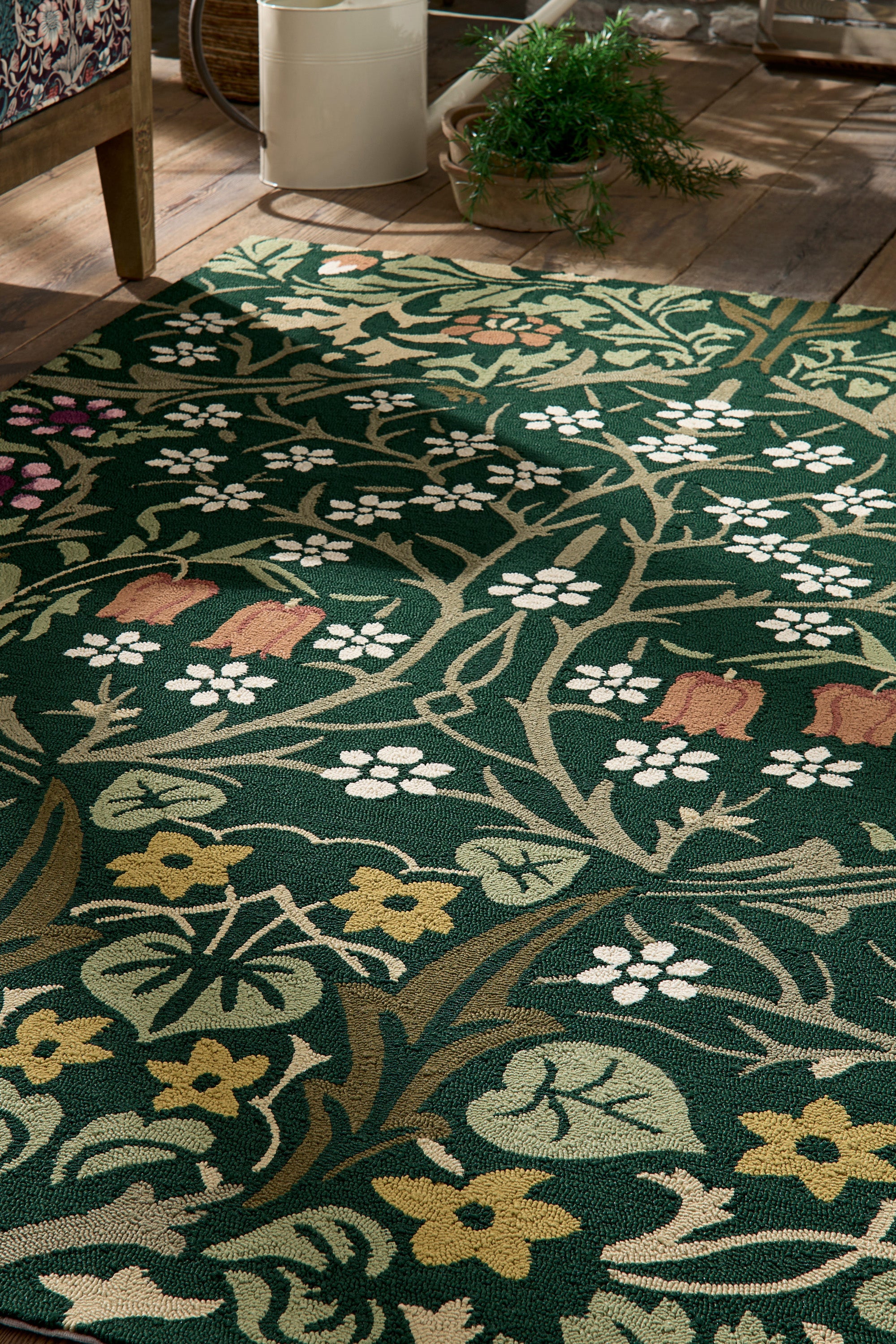 green indoor/outdoor rug with floral pattern