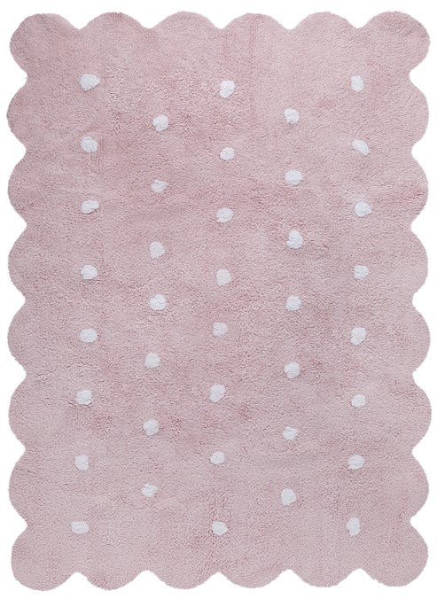 Rectangular pink cotton rug with a scalloped border and white polka dot design