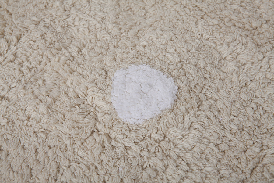 Rectangular beige cotton rug with scalloped border and white polka dot design