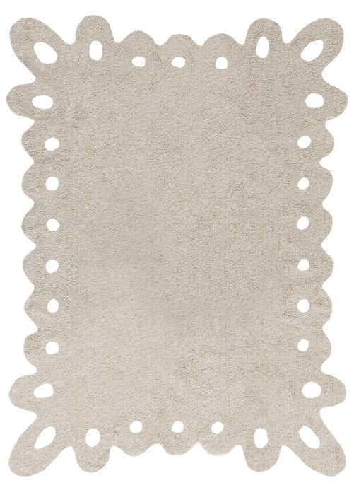 Rectangular beige cotton rug with wavy edge and cut out shapes