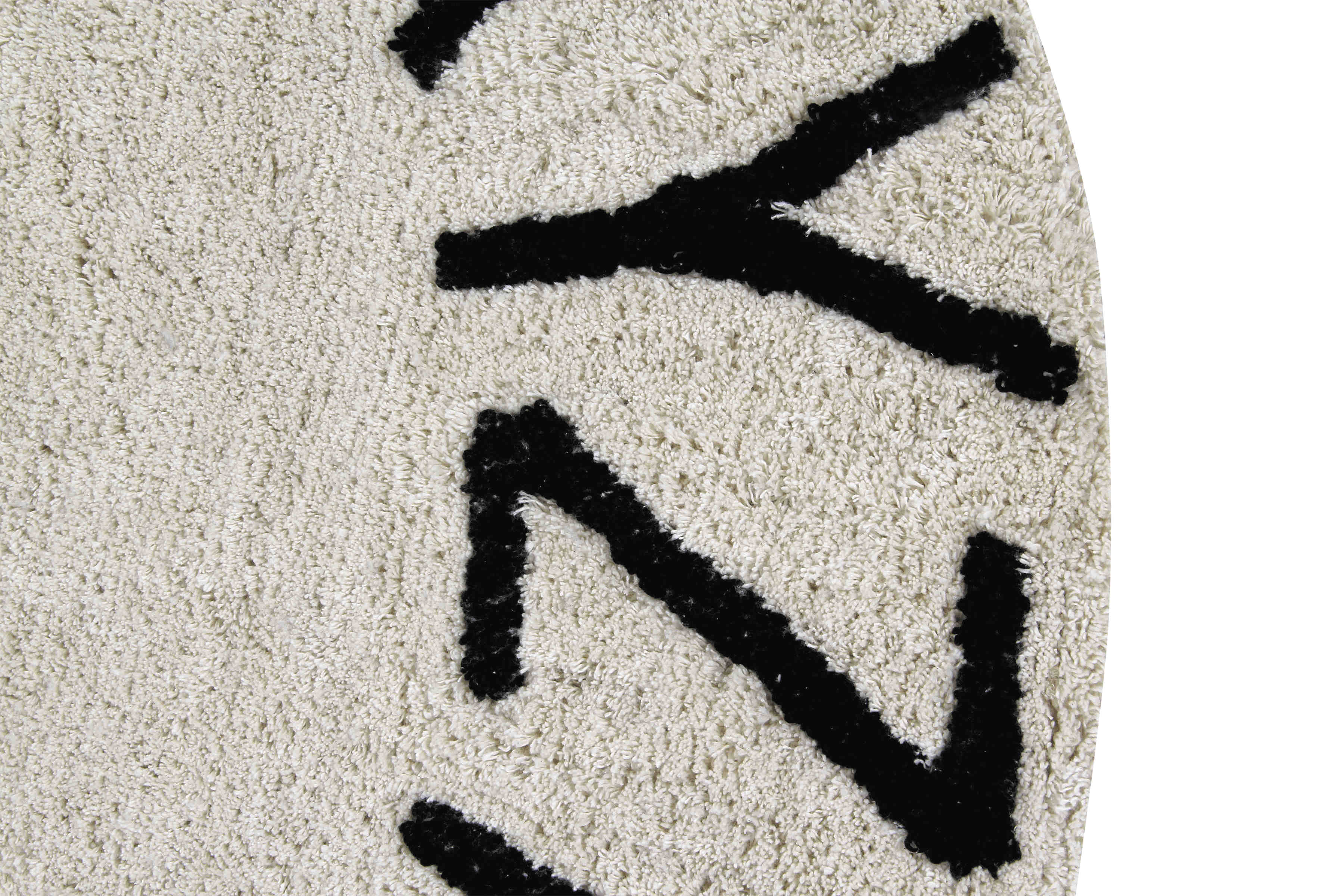 Circular white cotton rug decorated with a black alphabet border