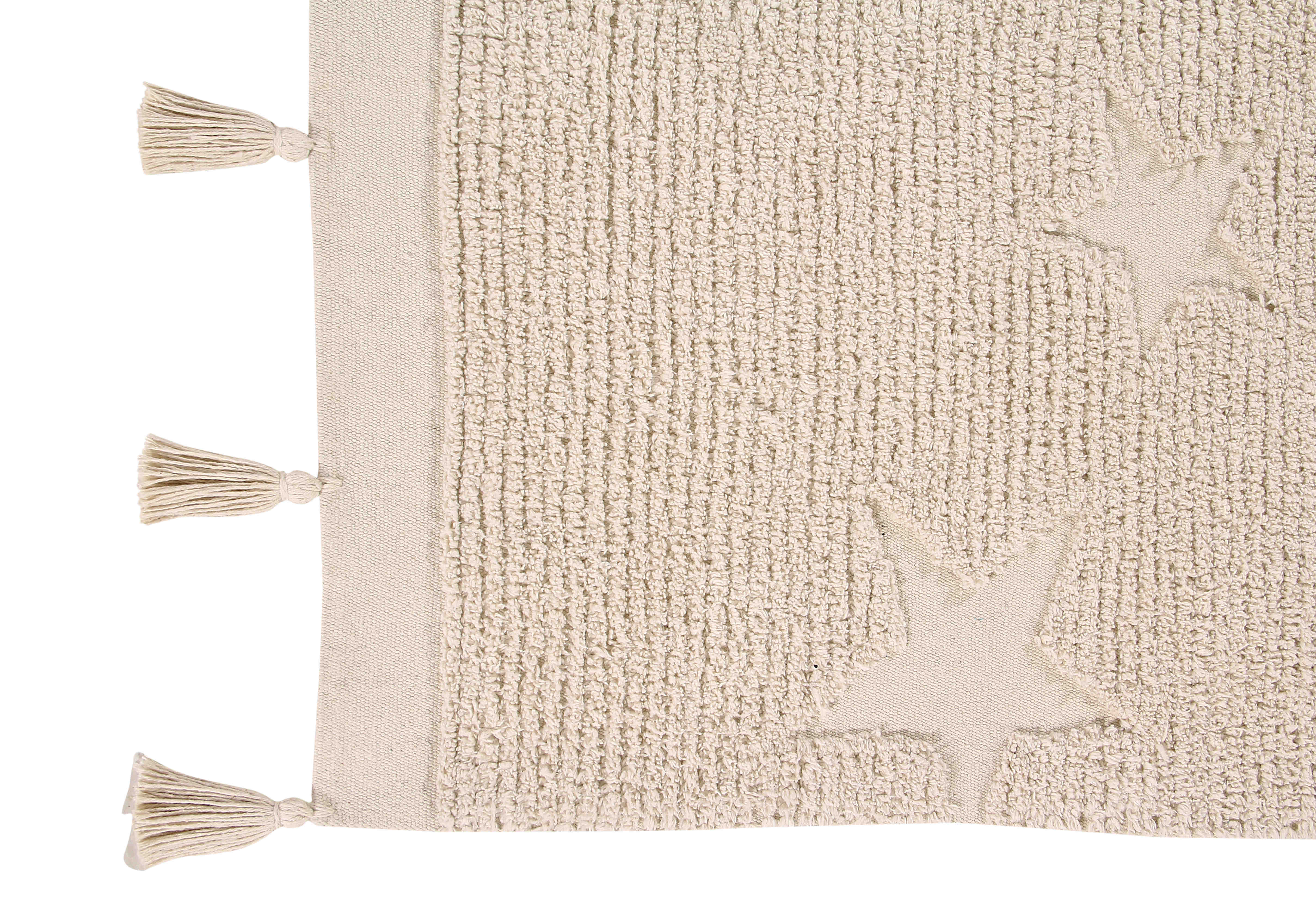 Rectangular natural cotton rug decorated with exposed stars and a tassel border.