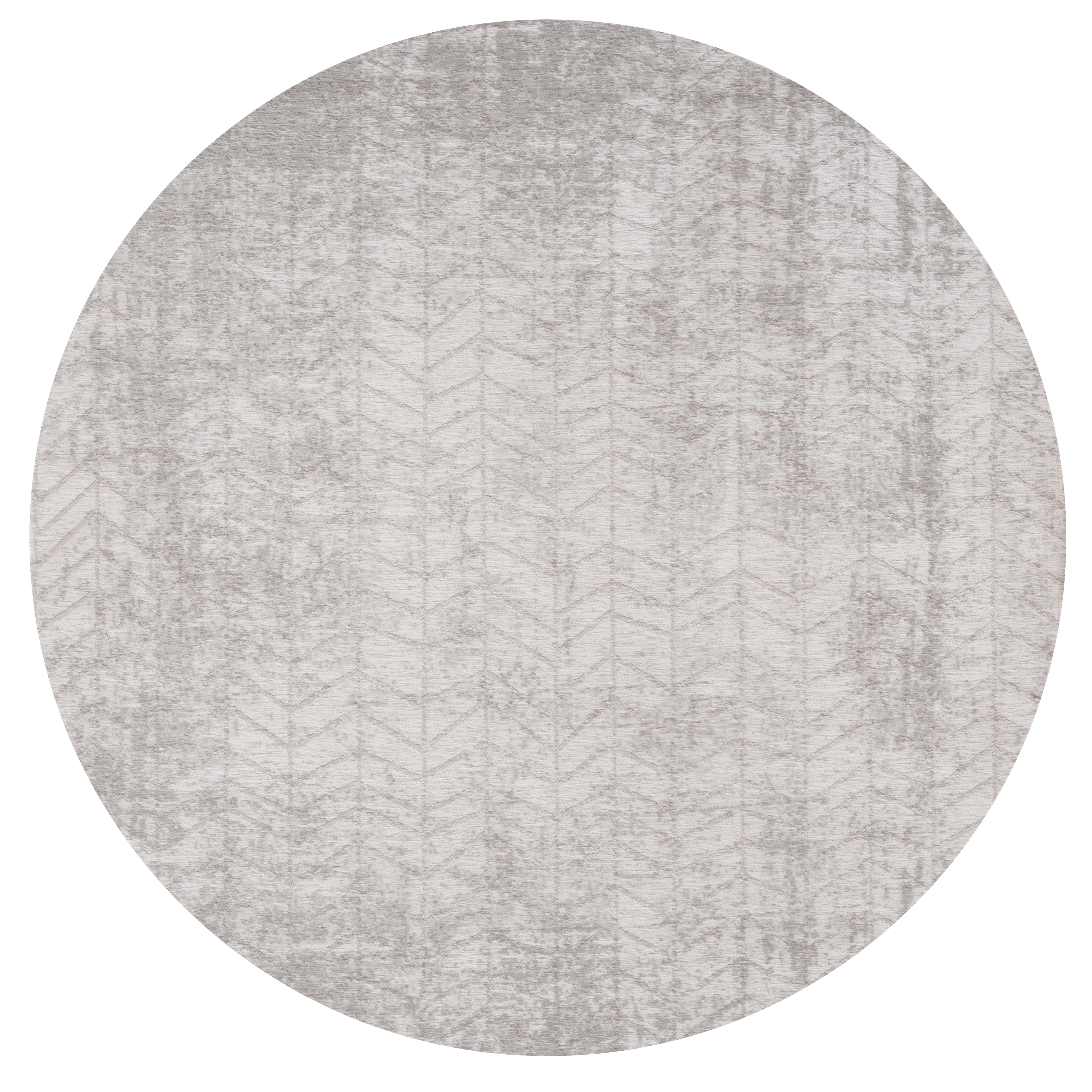 Circle Ivory flatweave rug with faded grey chevron pattern