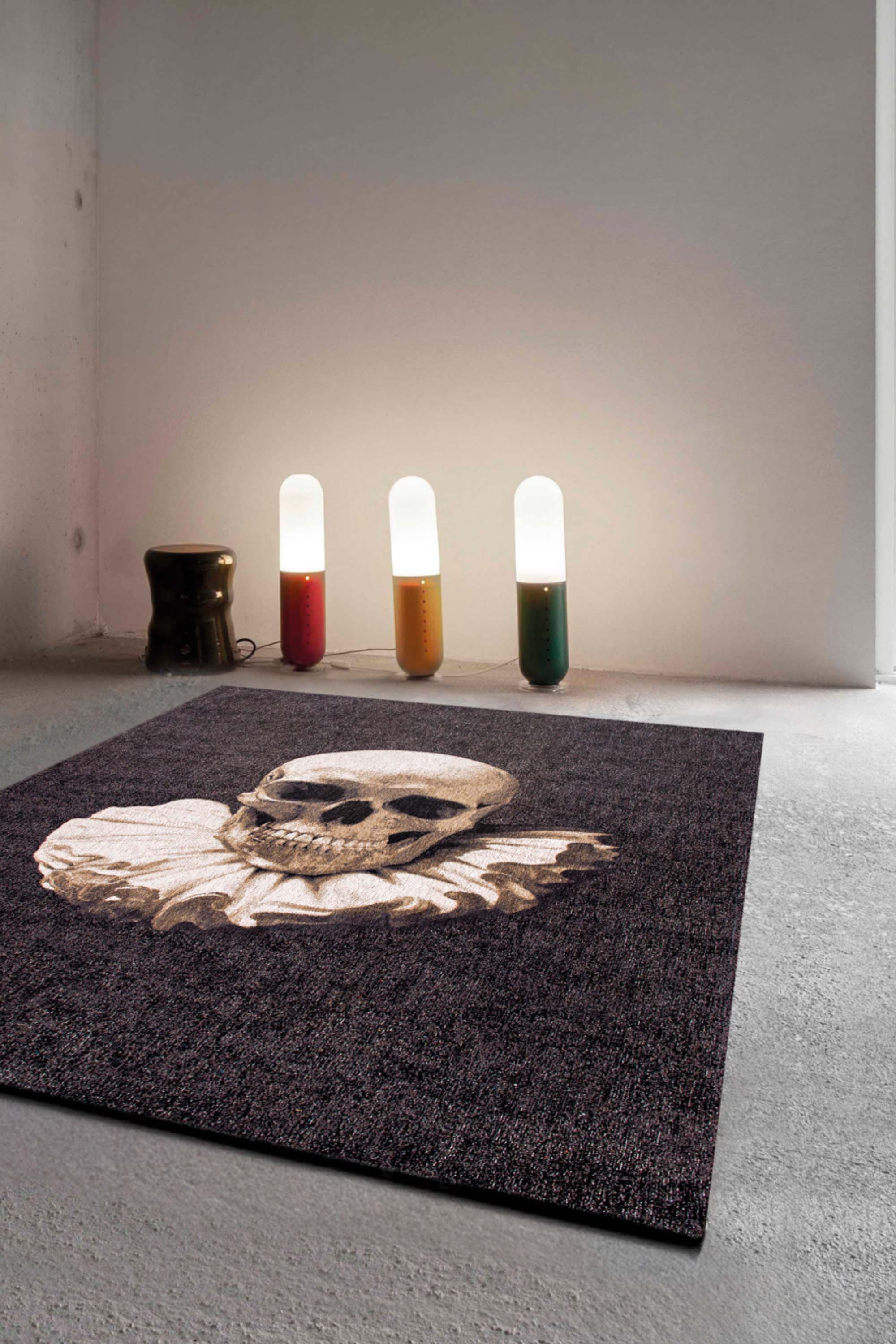 Modern black rug with detailed memento mori print