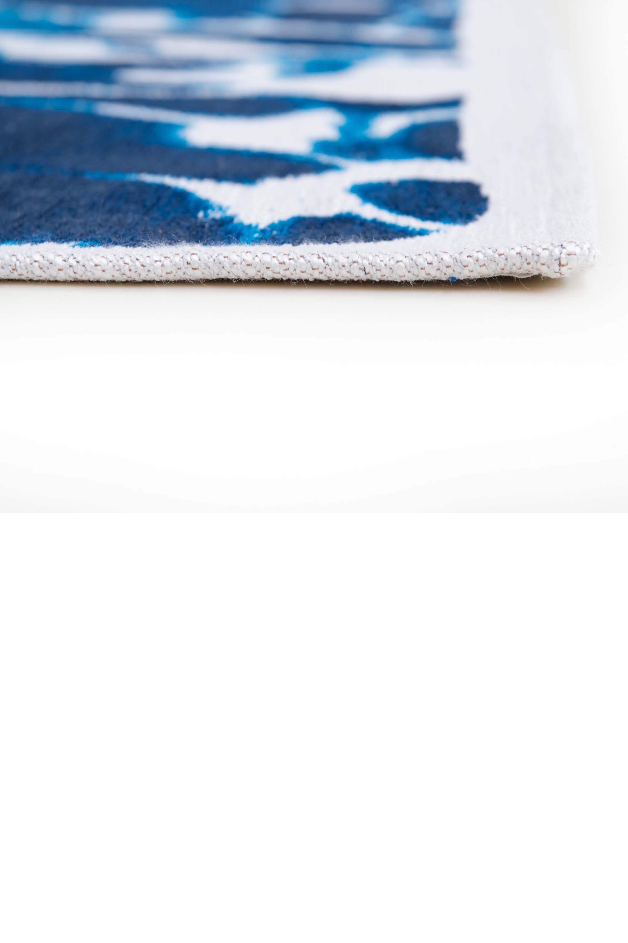 Modern runner rug with blue abstract water inspired pattern