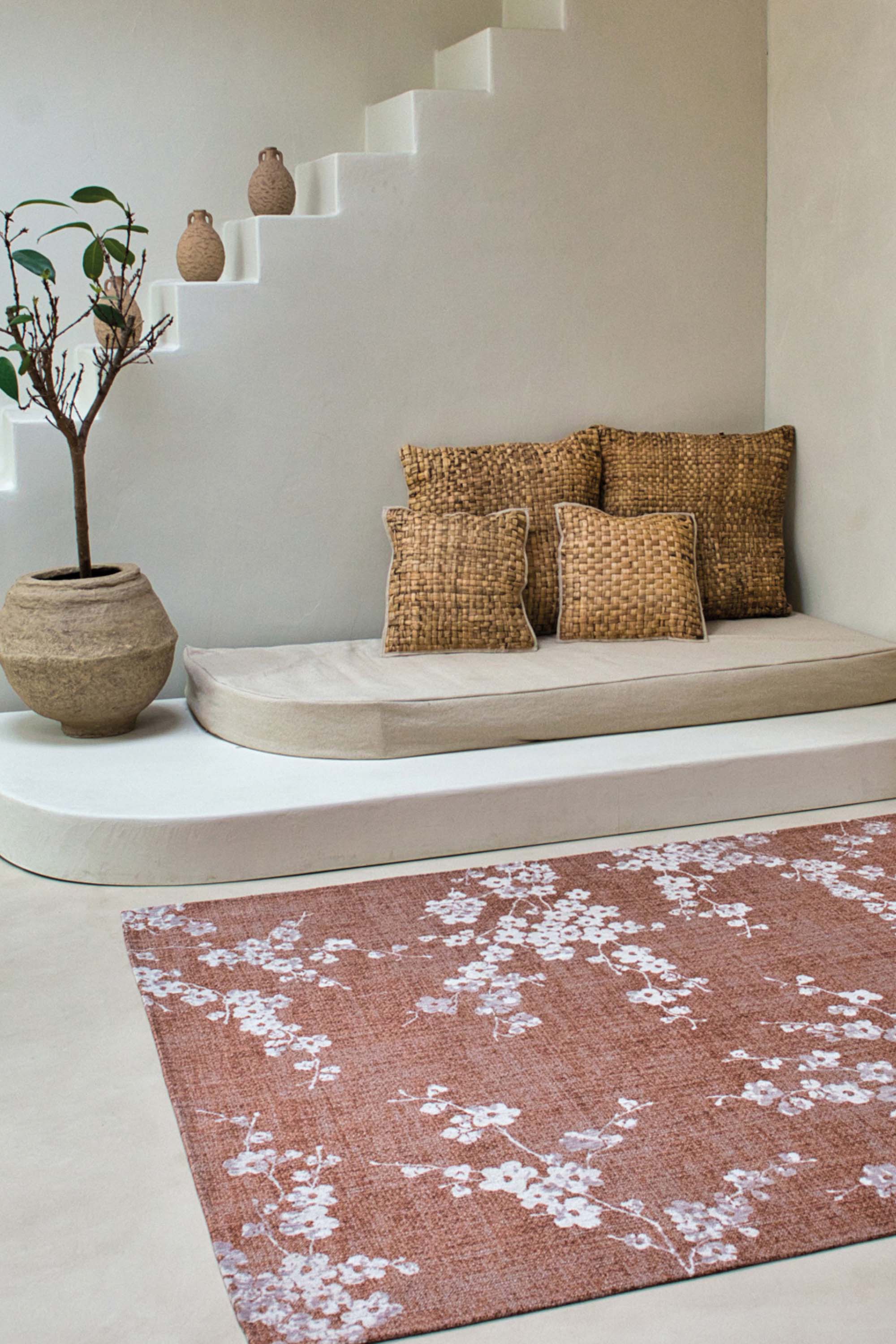 Modern abstract rug with subtle pink floral pattern