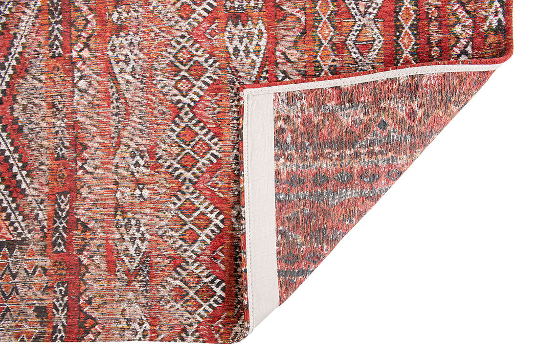 red rug with a moroccan geometric pattern