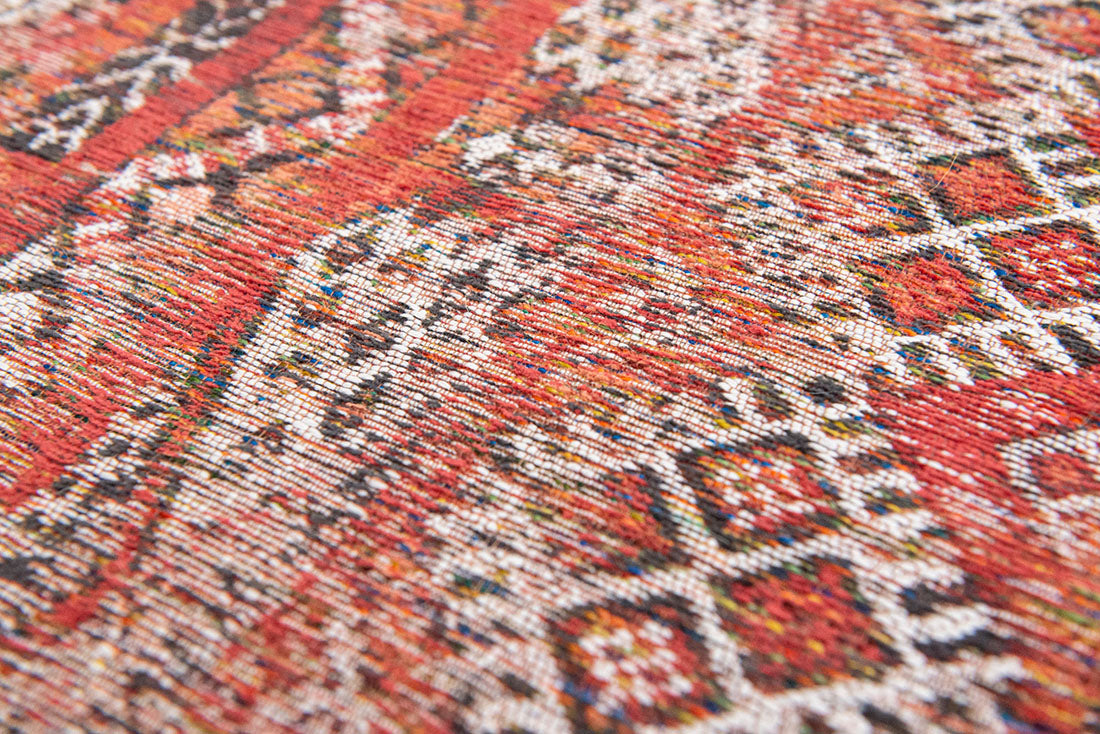 red rug with a moroccan geometric pattern