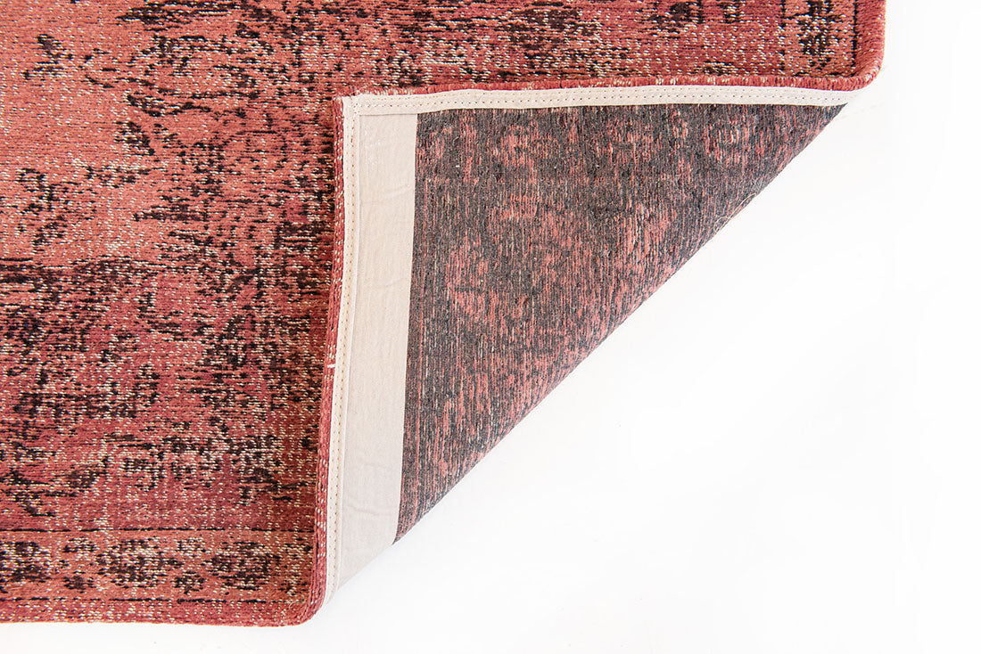 red vintage style rug with a traditional design