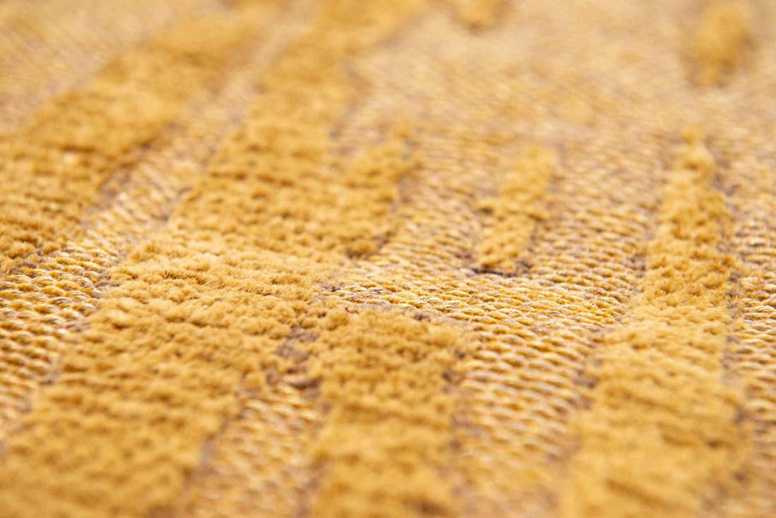 gold flatweave area rug with subtle