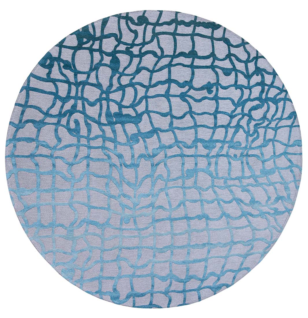 flatweave circle rug with abstract blue design
