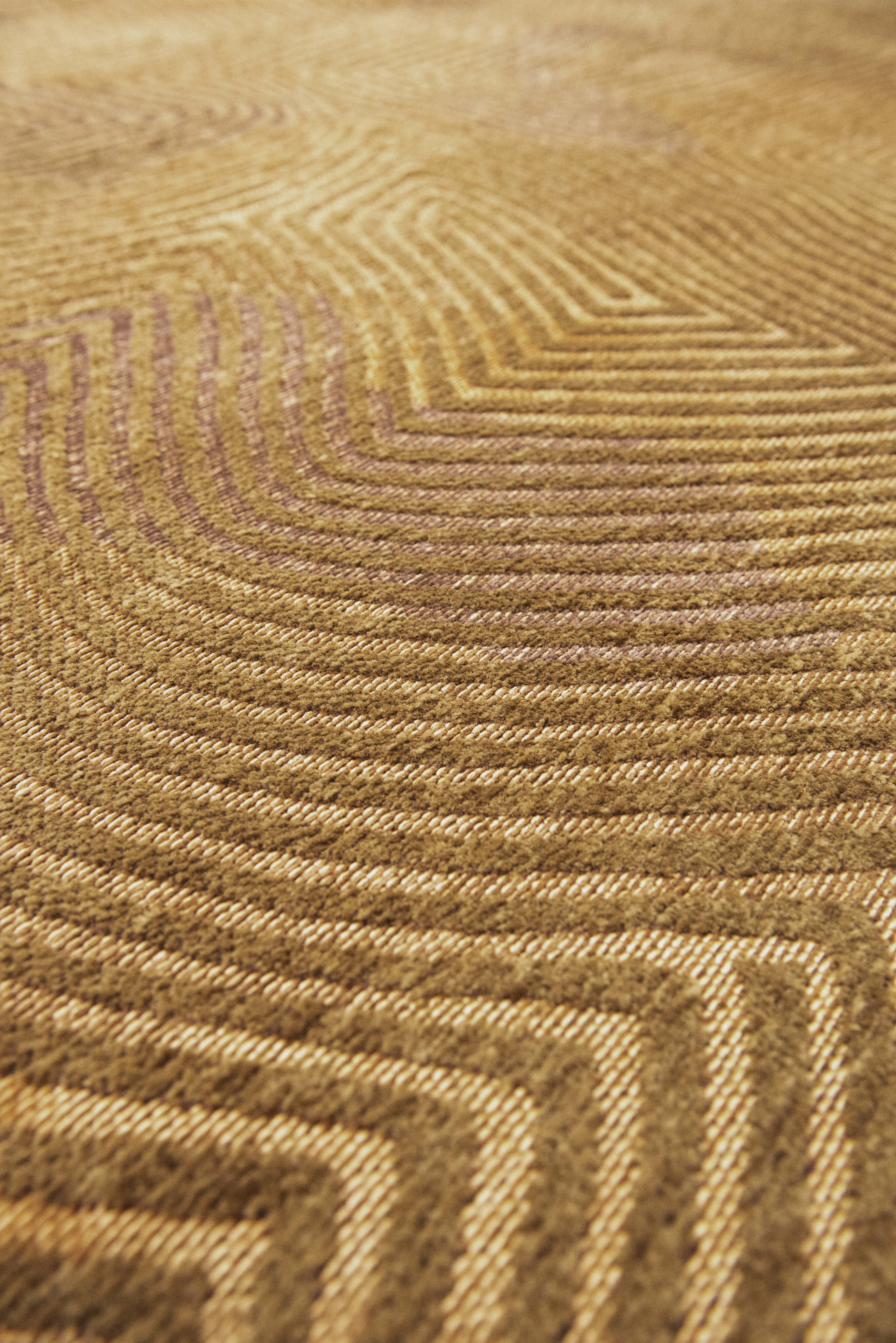 Gold flatweave area rug with organic, textured pattern