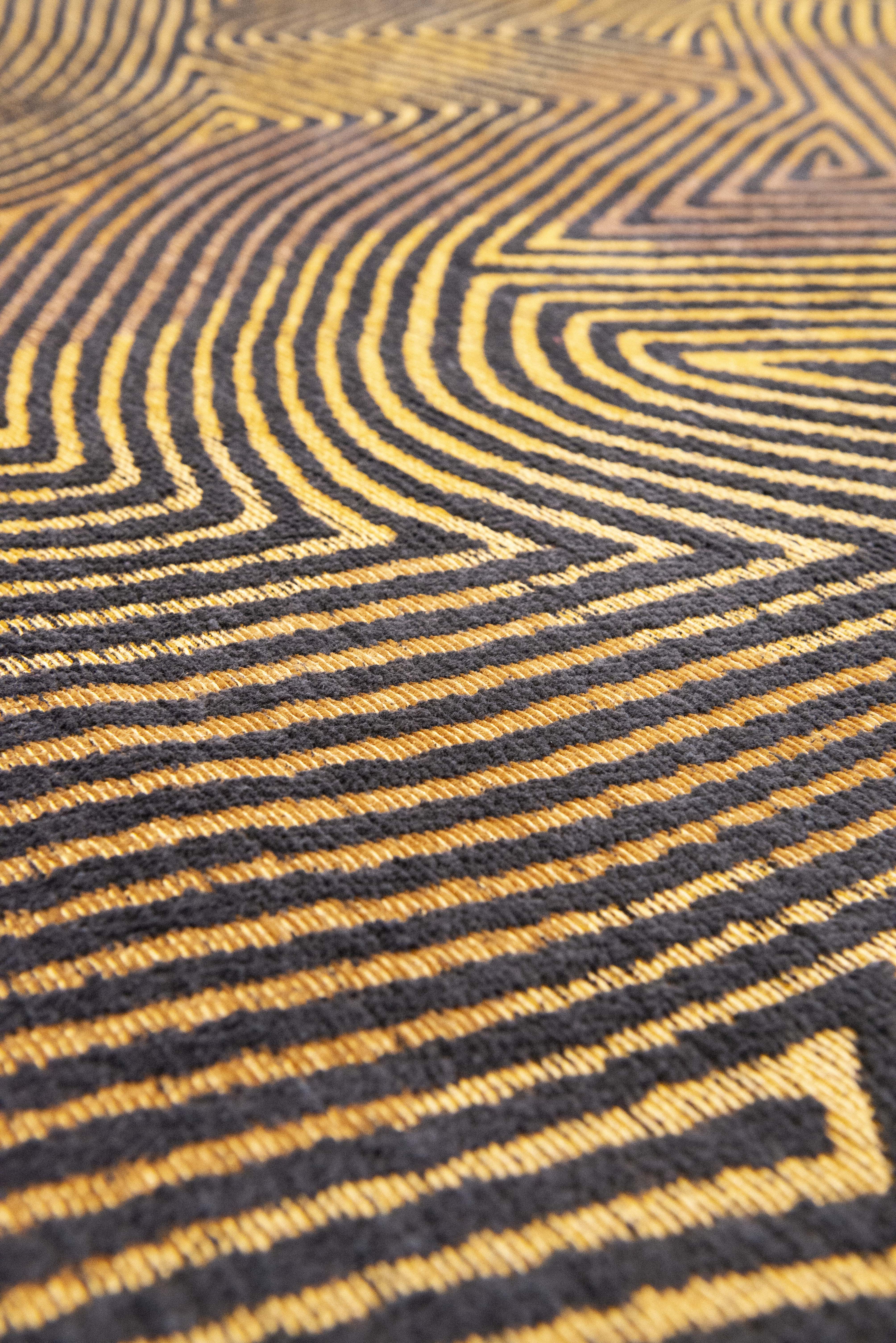 Black and gold flatweave Runner rug with organic, textured pattern