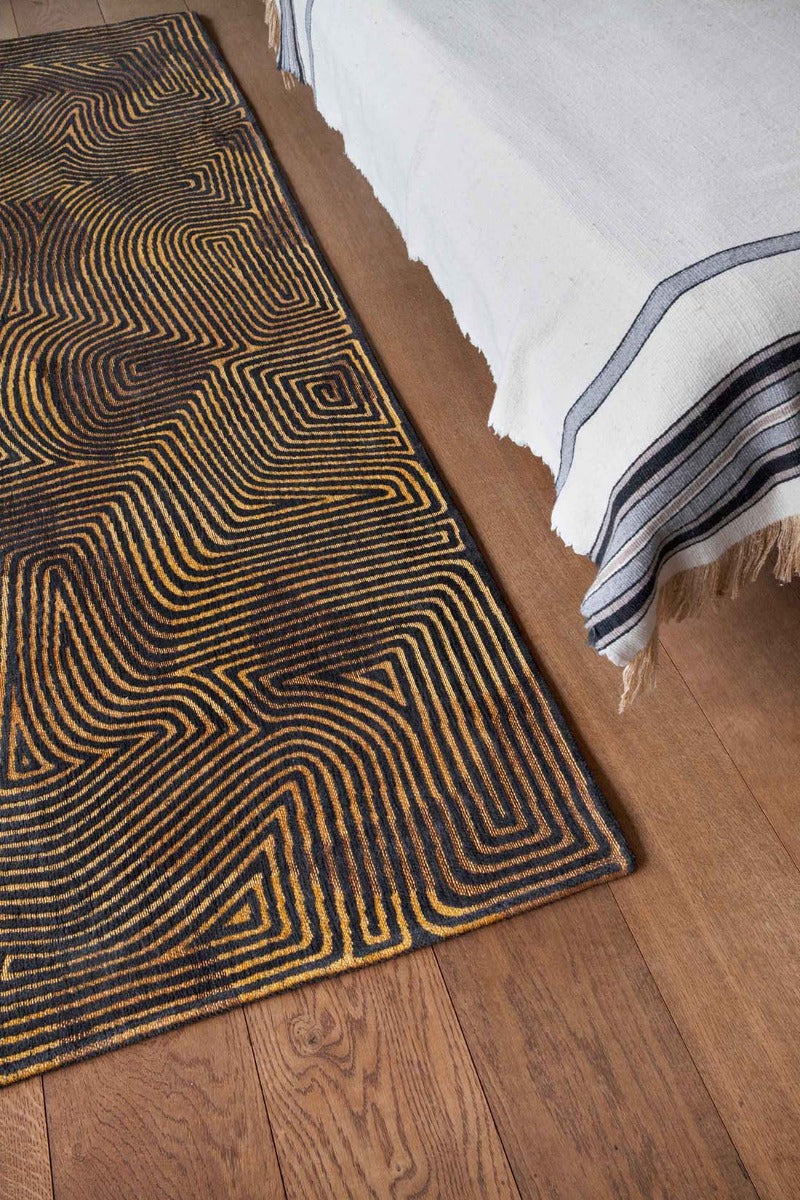 black and gold flatweave area rug with organic