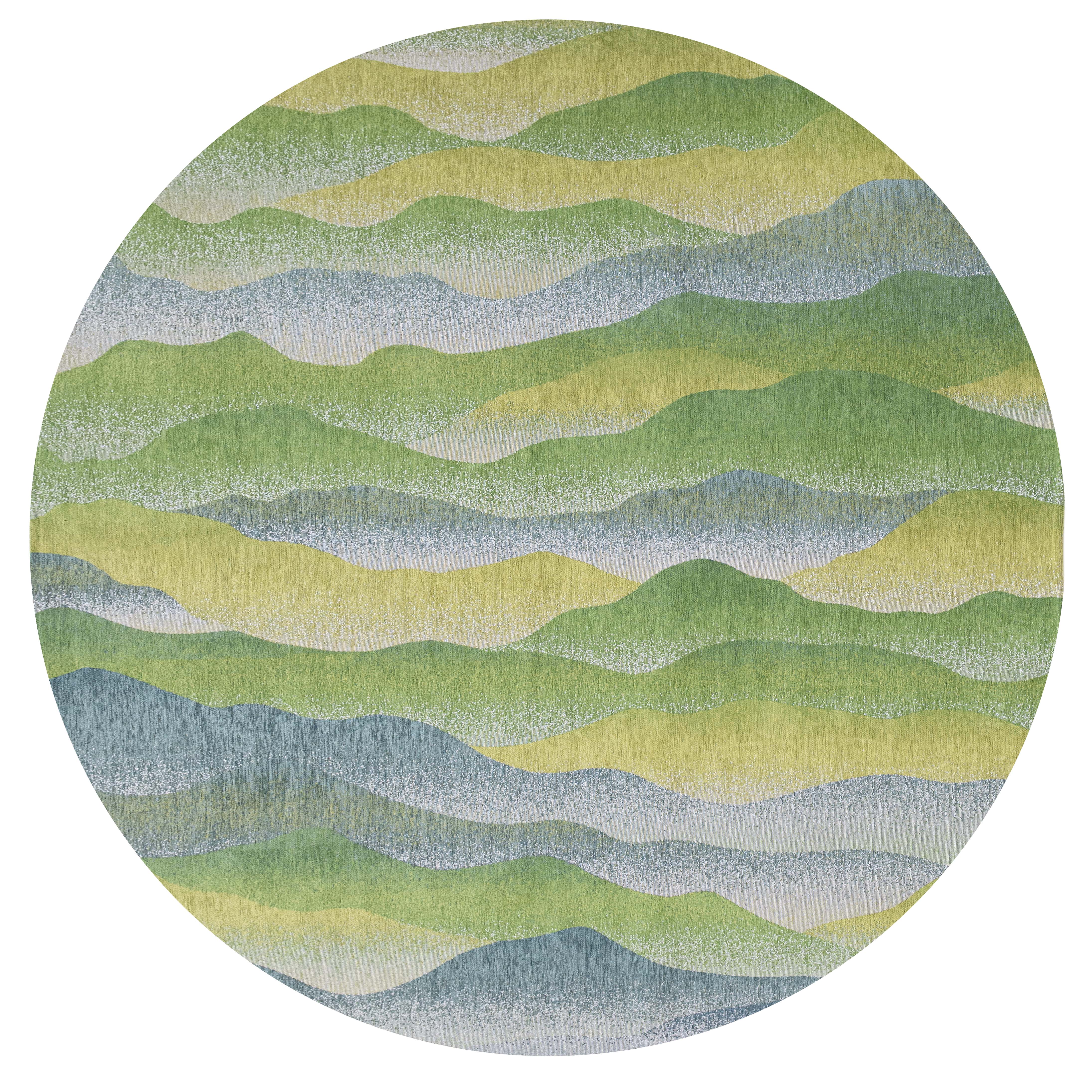 Modern circle rug with green abstract mountain range pattern
