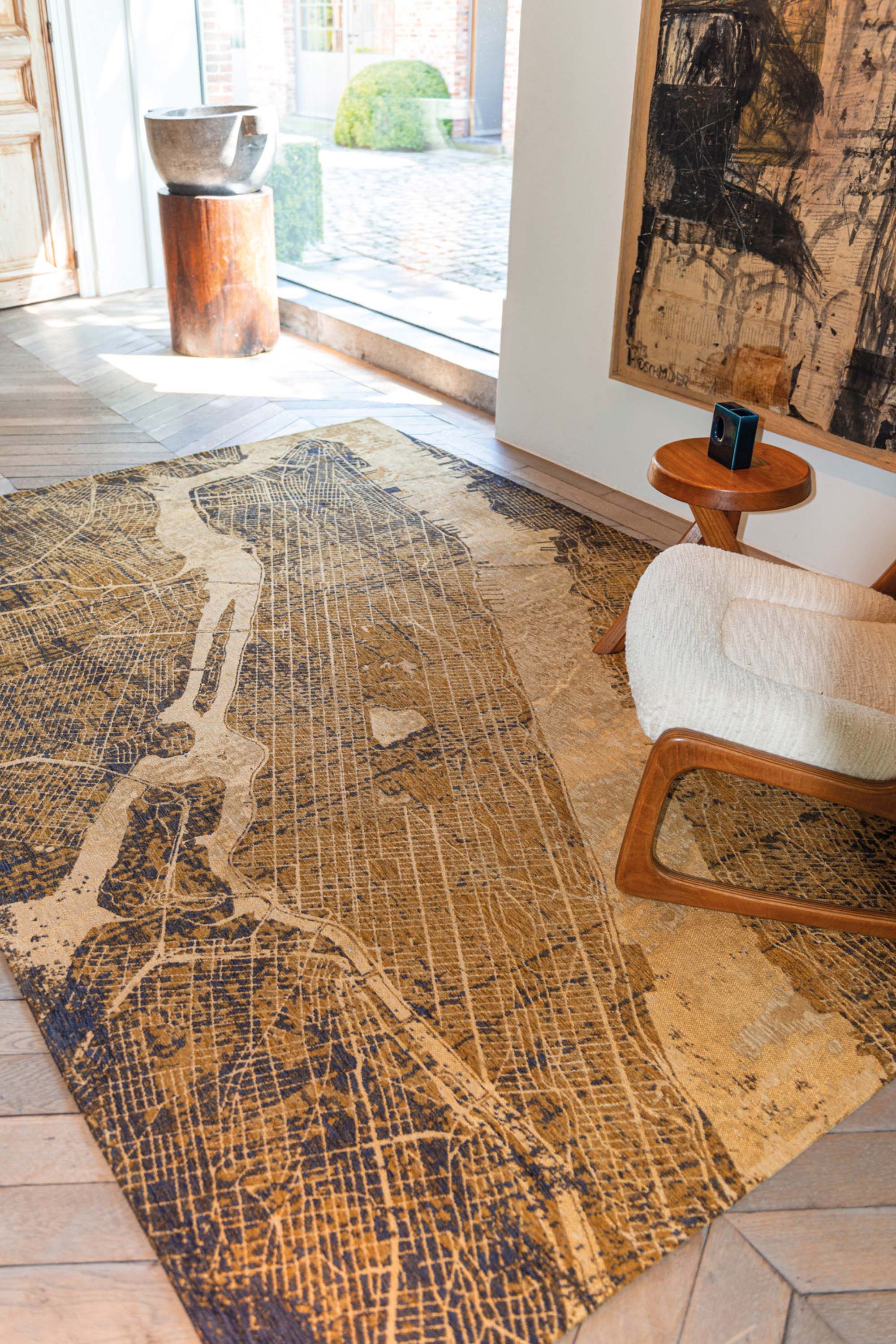 Gold abstract rug with a pattern inspired by the map of New York