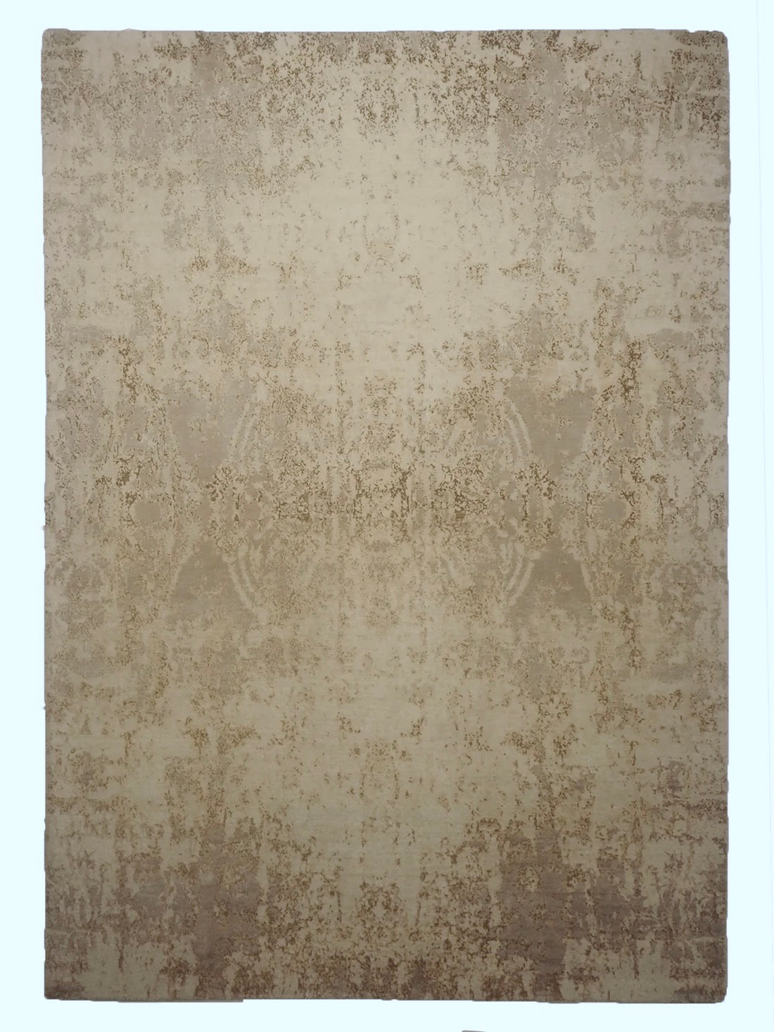 grey and taupe rug with an abstract damask pattern