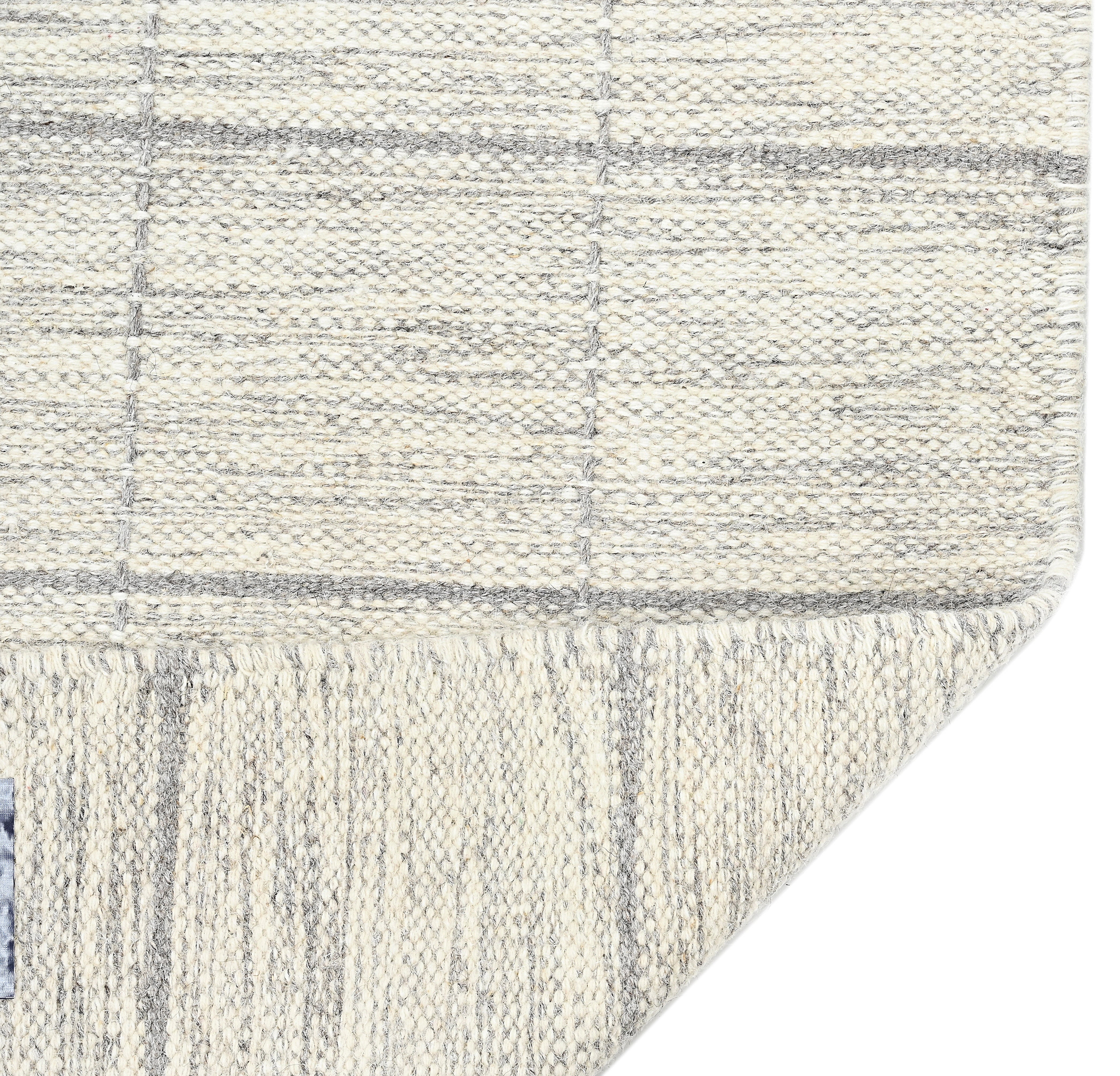 Beige neutral area rug with checkered design