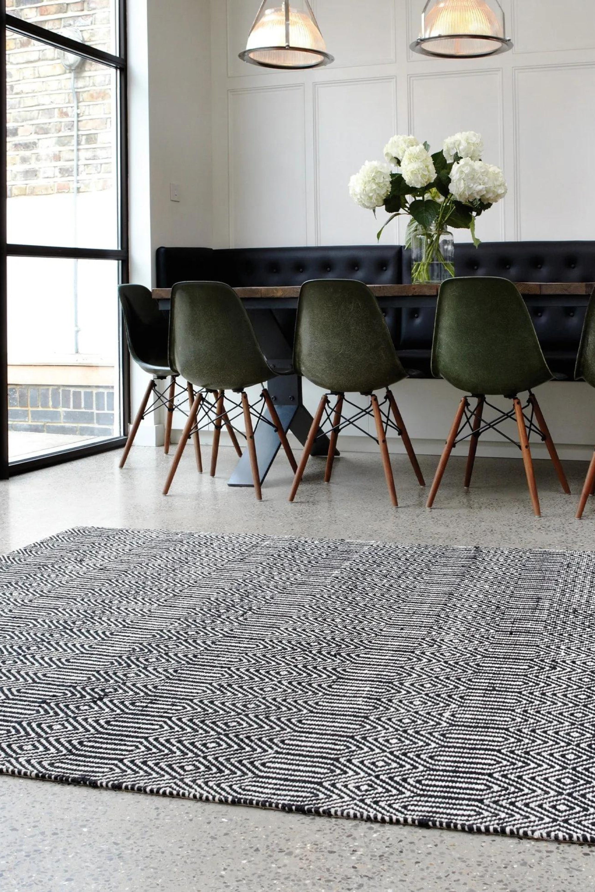 black and white woven rug with aztec chevron pattern