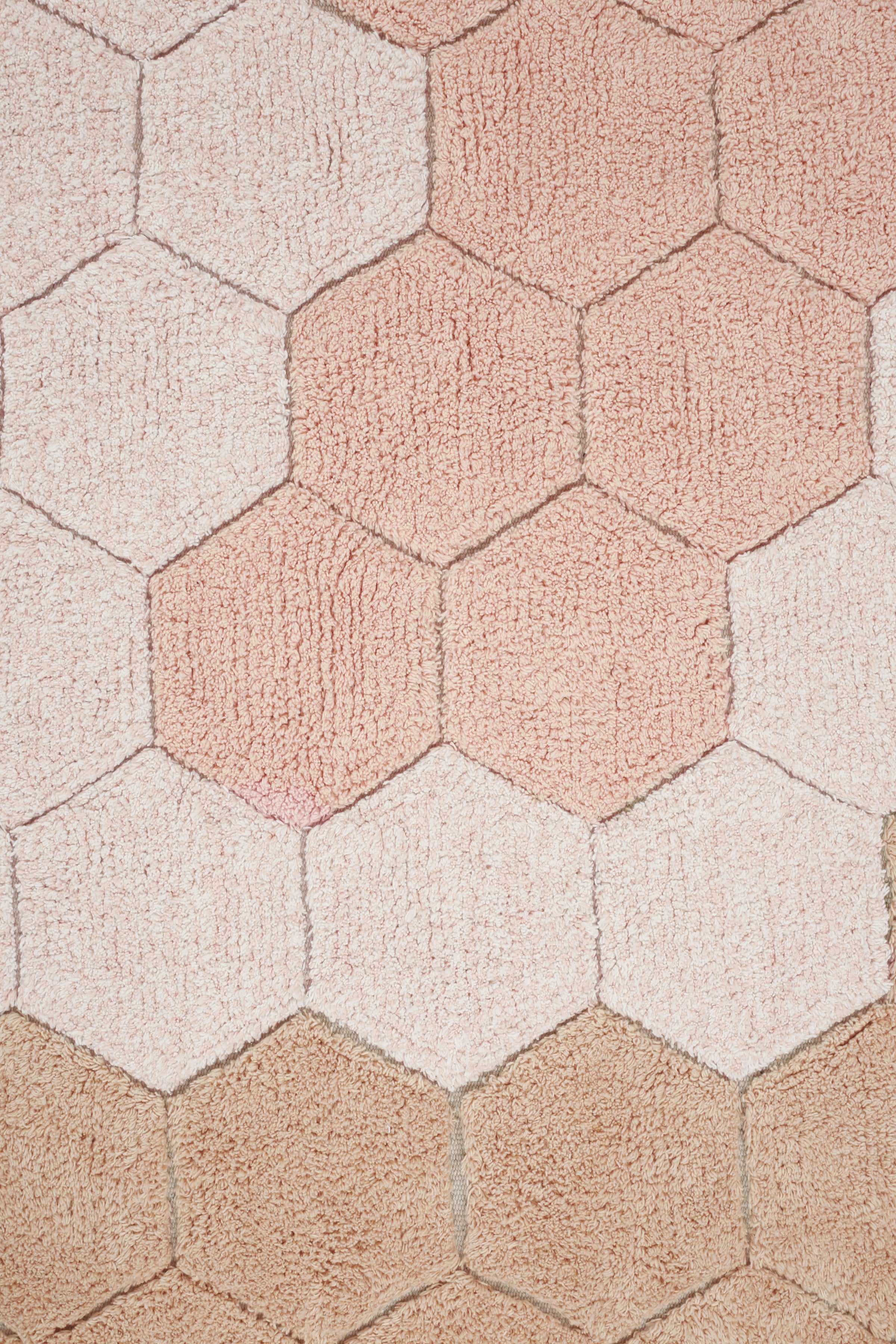 Round rose pink rug with honeycomb pattern